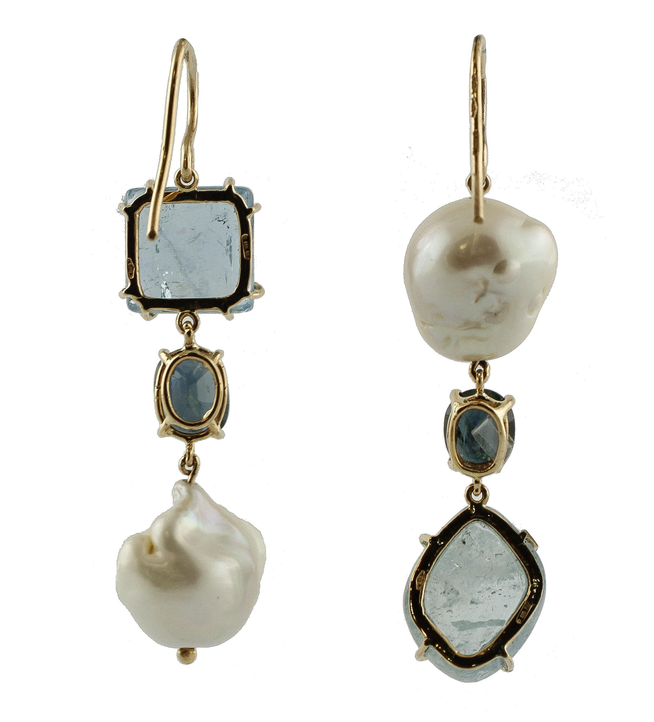 Unique drop earrings in 14K rose gold composed in two different ways: one is composed of square shape (16 mm X 16 mm) aquamarine at the top, blue sapphire in the middle and a pearl (15 mm) at the bottom; the other one is composed of a pearl (14 mm)
