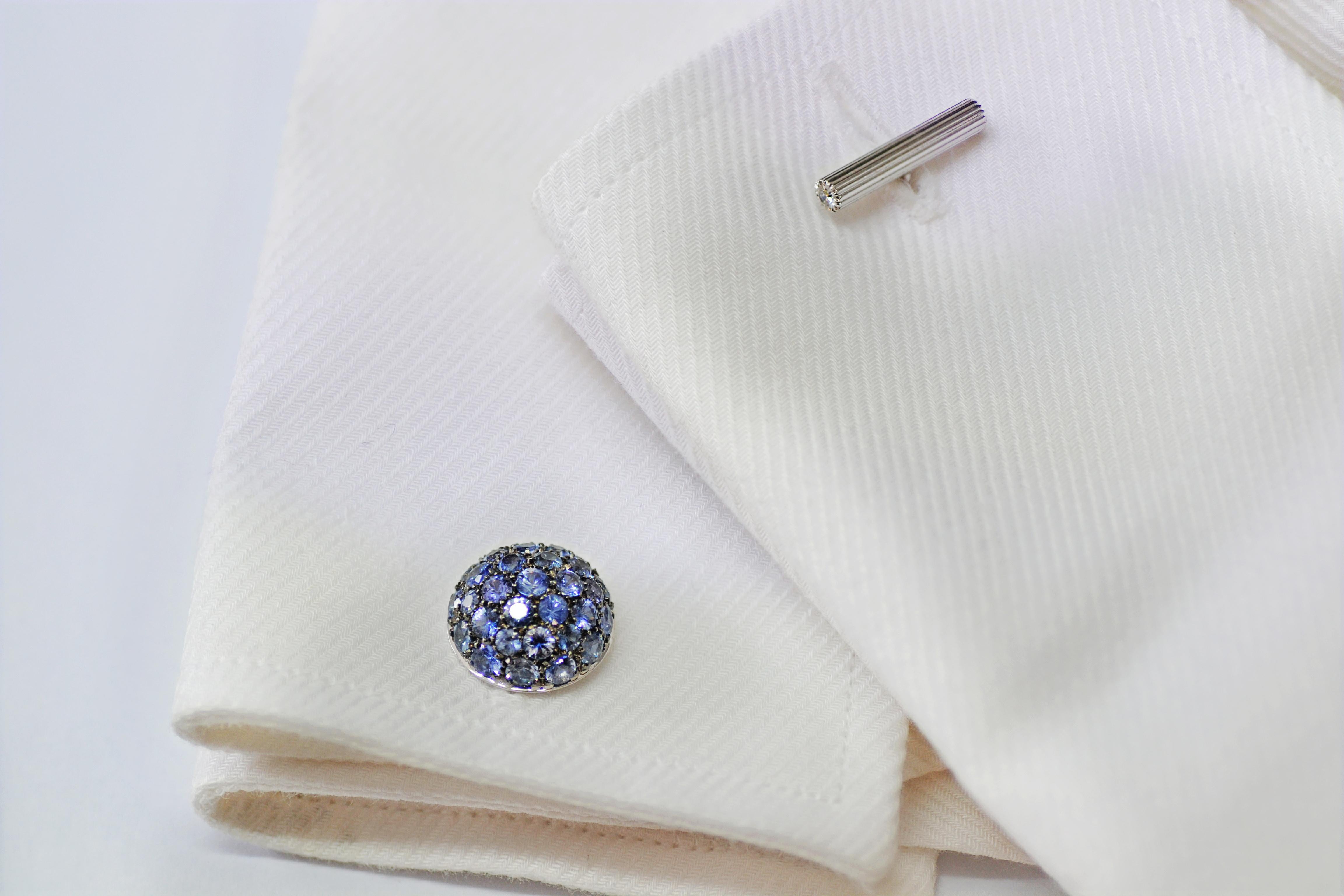 Handcrafted in Margherita Burgener family workshop, located in Valenza - Italy
The cufflinks are bombé, like an half ball, fully pavé set in blue sapphires. 
The pavé part is blackened to highlight the blue of the sapphires. It is a unisex piece of