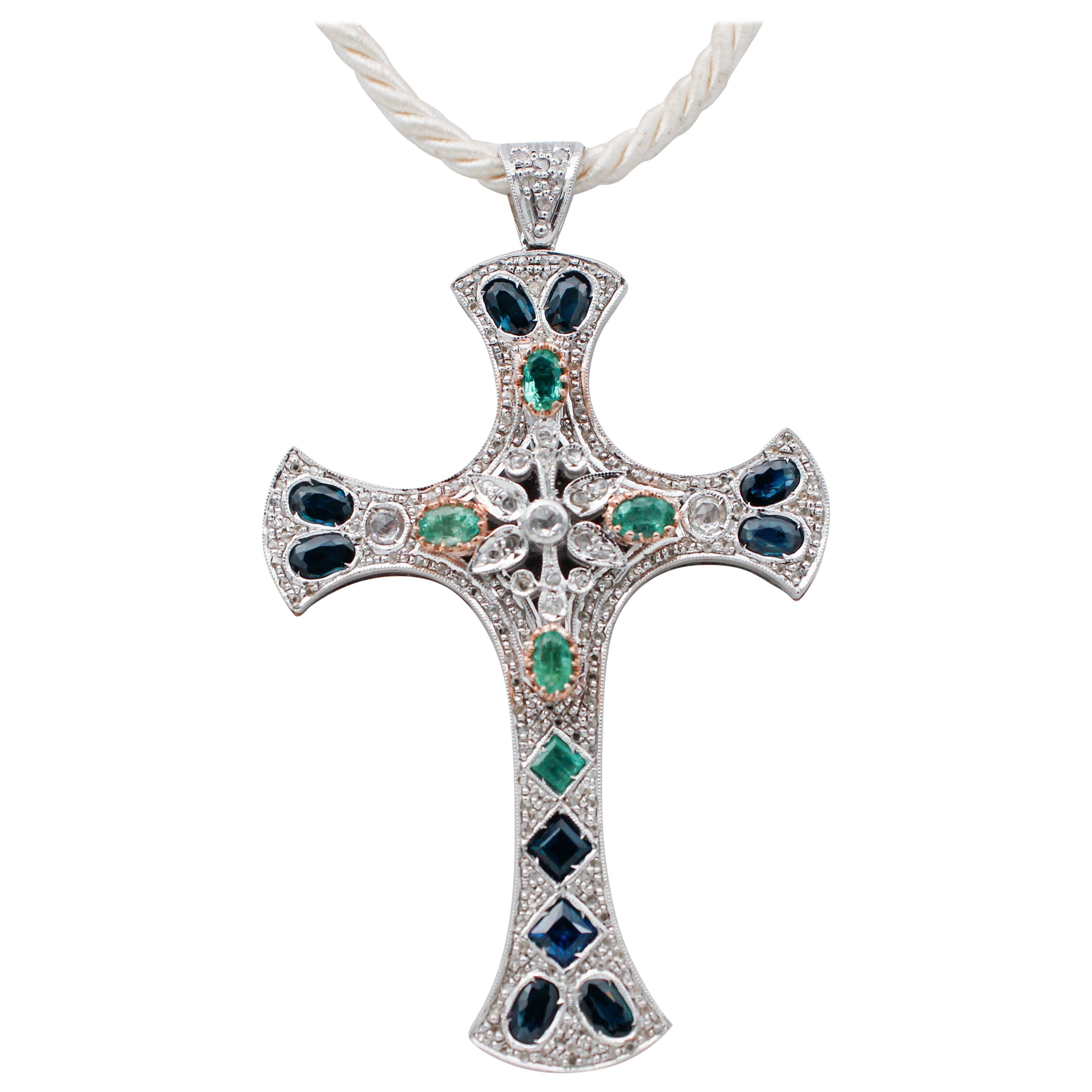 Blue Sapphires, Emeralds, Diamonds, 9 Karat Yellow Gold and Silver Cross Pendant For Sale