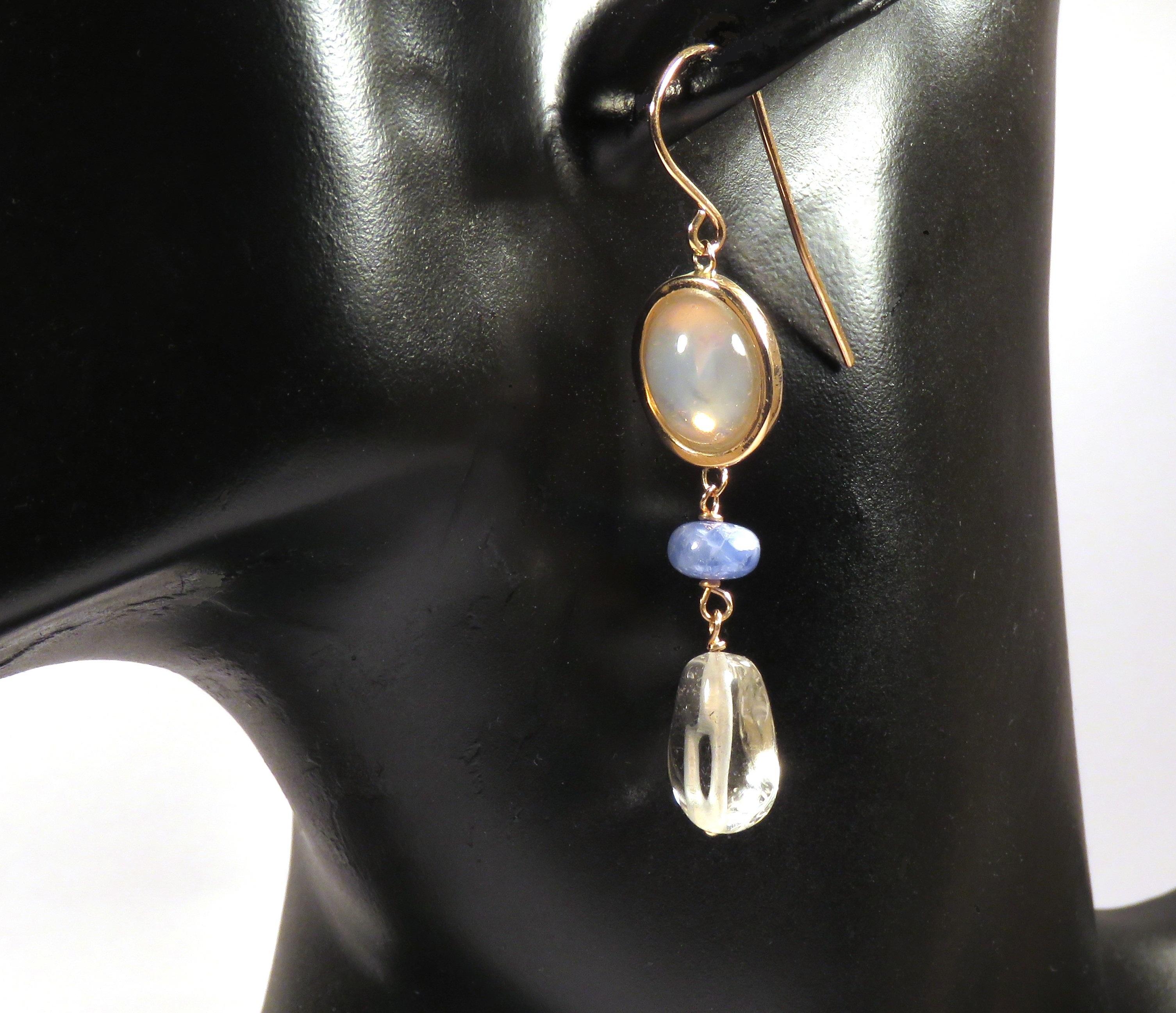 Beautiful dangle earrings in 9 karat rose gold with real oval cabochon cut moonstones, blue sapphires and rock crystal. The length of each earring is 60 mm / 2.362 inches. Each item is stamped with the Italian gold mark 375 and Botta Gioielli