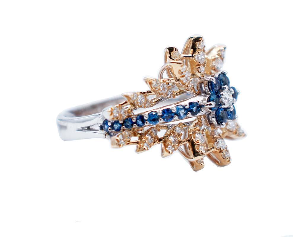 Beautiful ring in 18 karat white and yellow gold structure mounted with a flower of sapphires and a diamond and,Laterally, a row of sapphires. All is surrounded by leaves in yellow gold mounted with diamonds.
This ring was totally handmade by