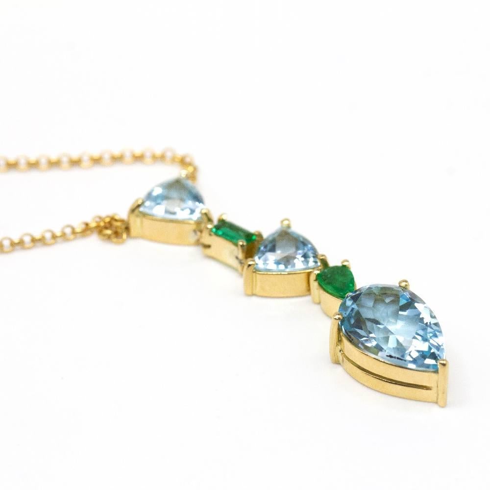 Aquamarine, Topaz and Emerald necklace for woman  1x Topaz Pear approx. weight 7.00ct, 2x Aquamarines Triangle approx. weight 6.00ct and 2x Emeralds approx. weight 0.38ct  18kt Yellow Gold  8.79 grams.  Pendant measures: 4,5cm length and 1,0 cm