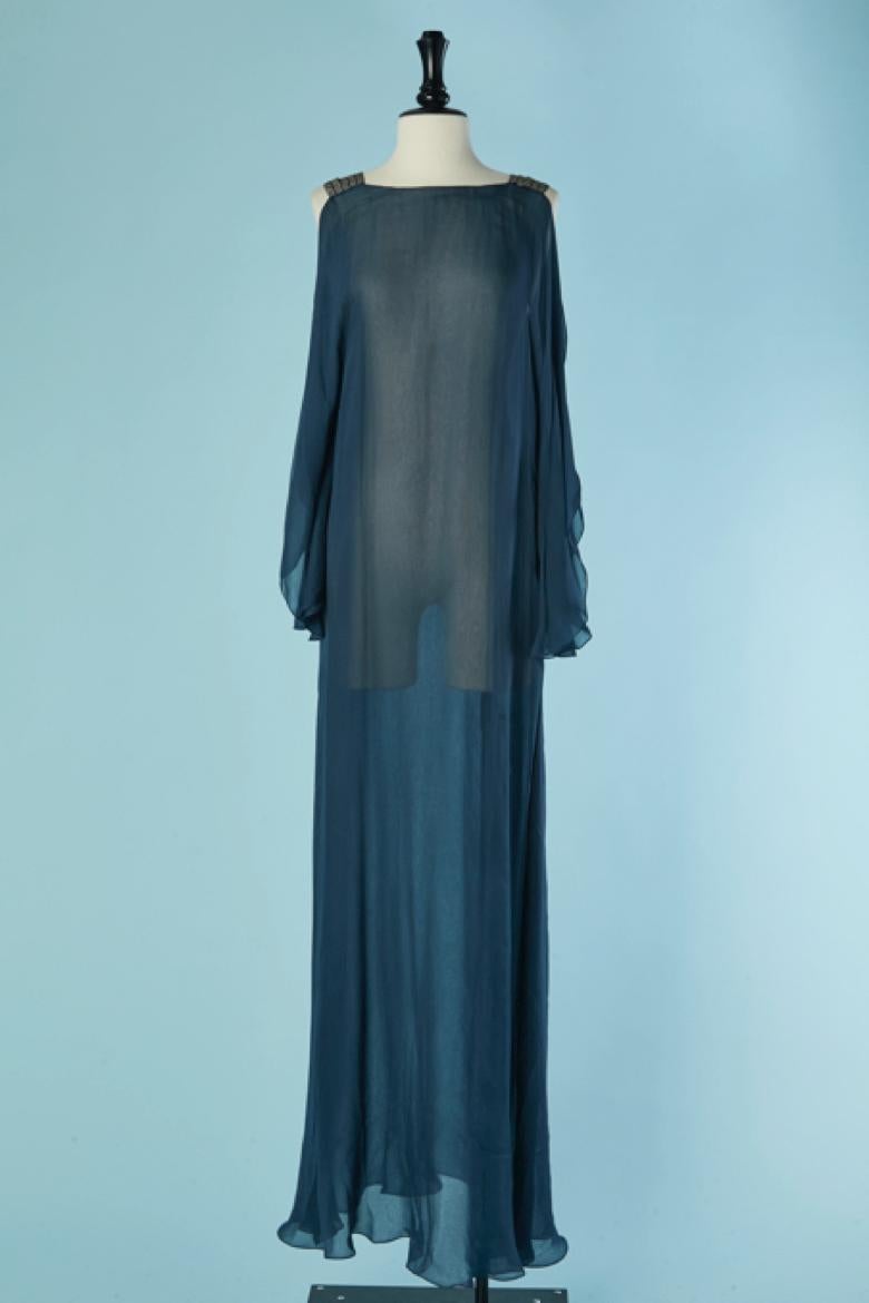 Blue see-through silk chiffon evening dress. Rhinestone shoulder strap. Stitching on both side. 
SIZE M/L 