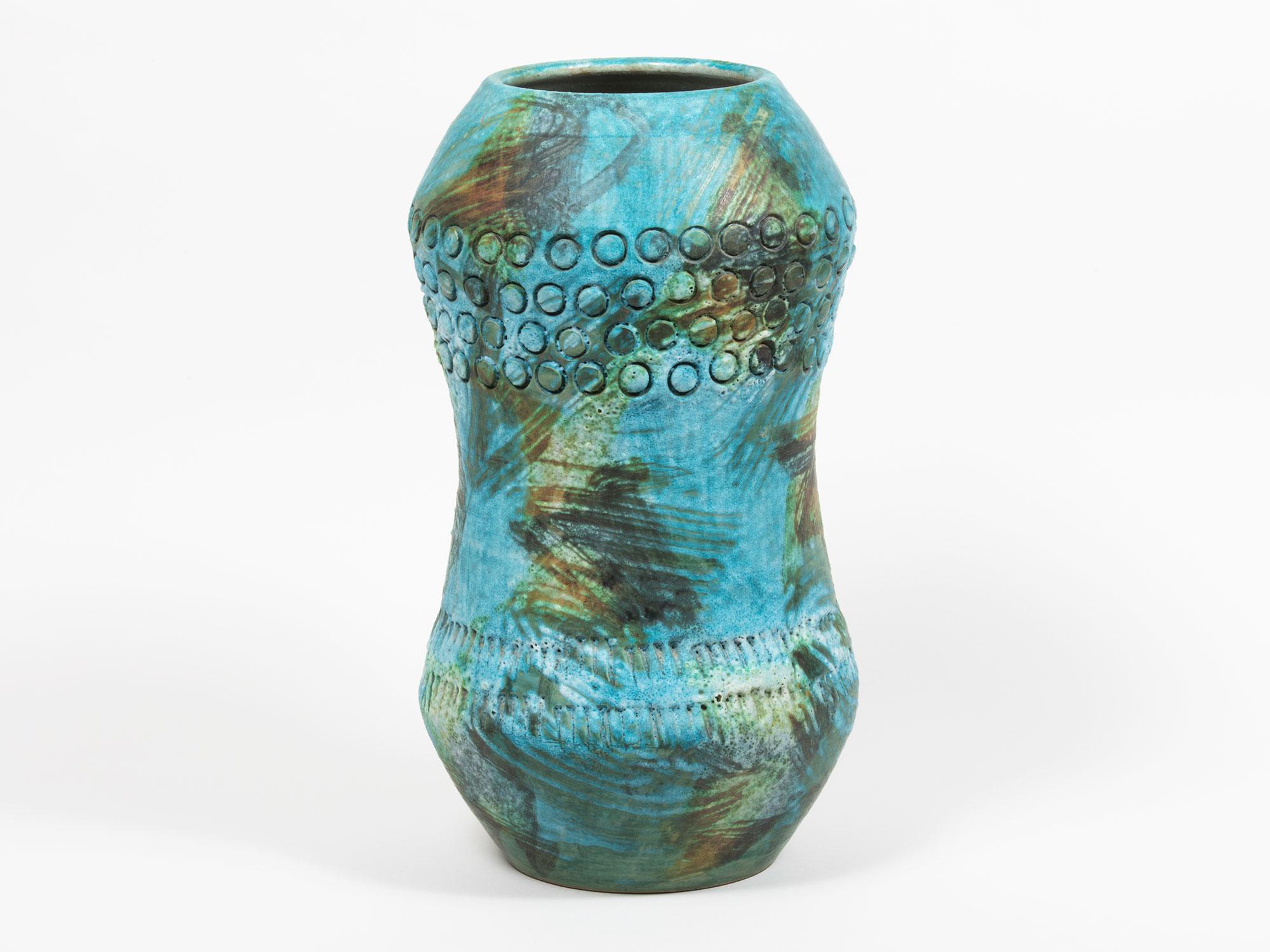 Massive turquoise hand-thrown glazed ceramic vessel, attributed to Aldo Londi for Bitossi. Features bands of stamped circle and line motifs around the top and bottom. Stamped 
