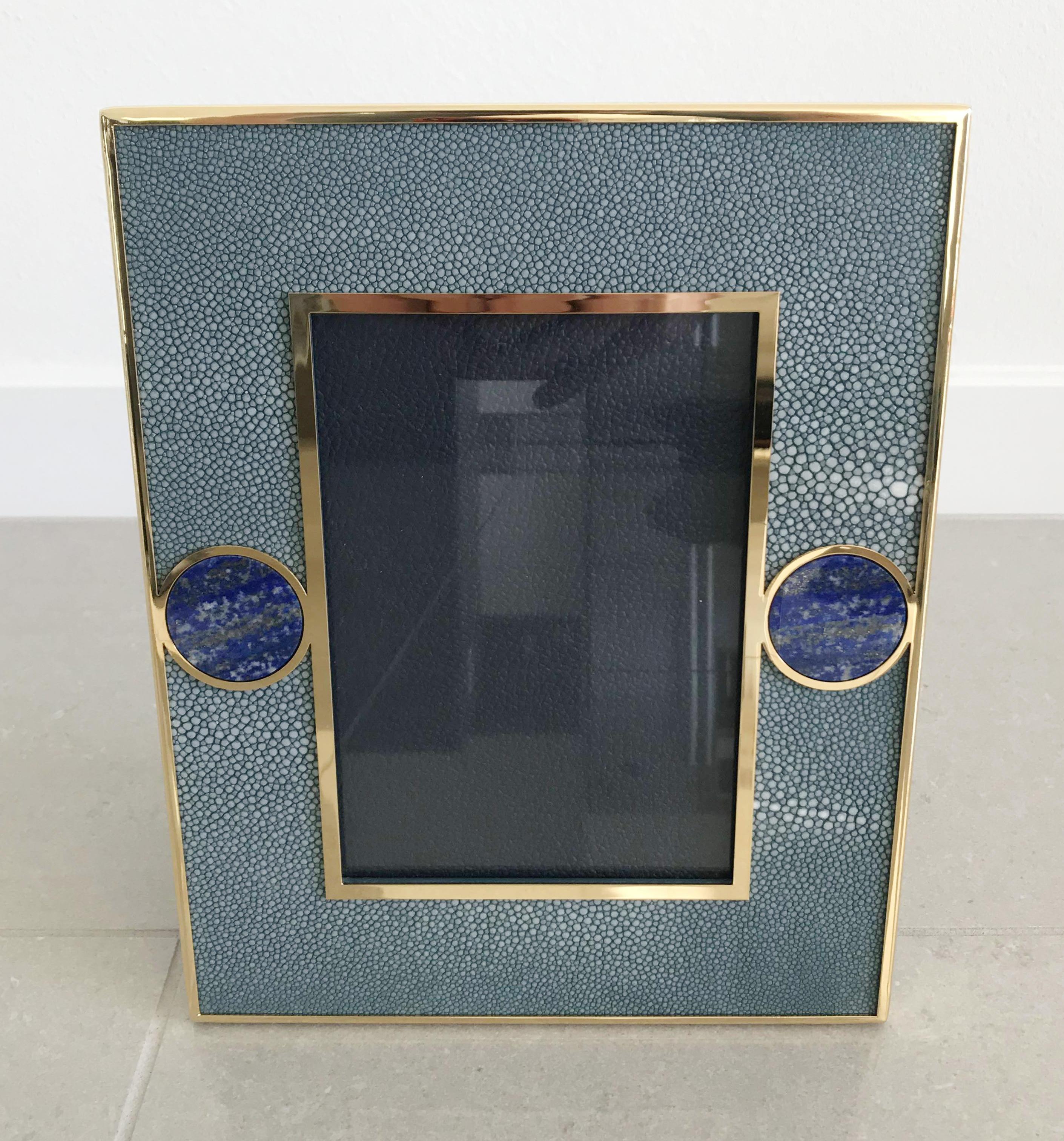 Blue shagreen leather with Lapis Lazuli inserts and gold-plated picture frame by Fabio Ltd
Measures: Height 10.5 inches, width 8.5 inches, depth 1 inch
Photo size: 5 inches by 7 inches
LAST 1 in stock in Los Angeles
Order Reference #: FABIOLTD