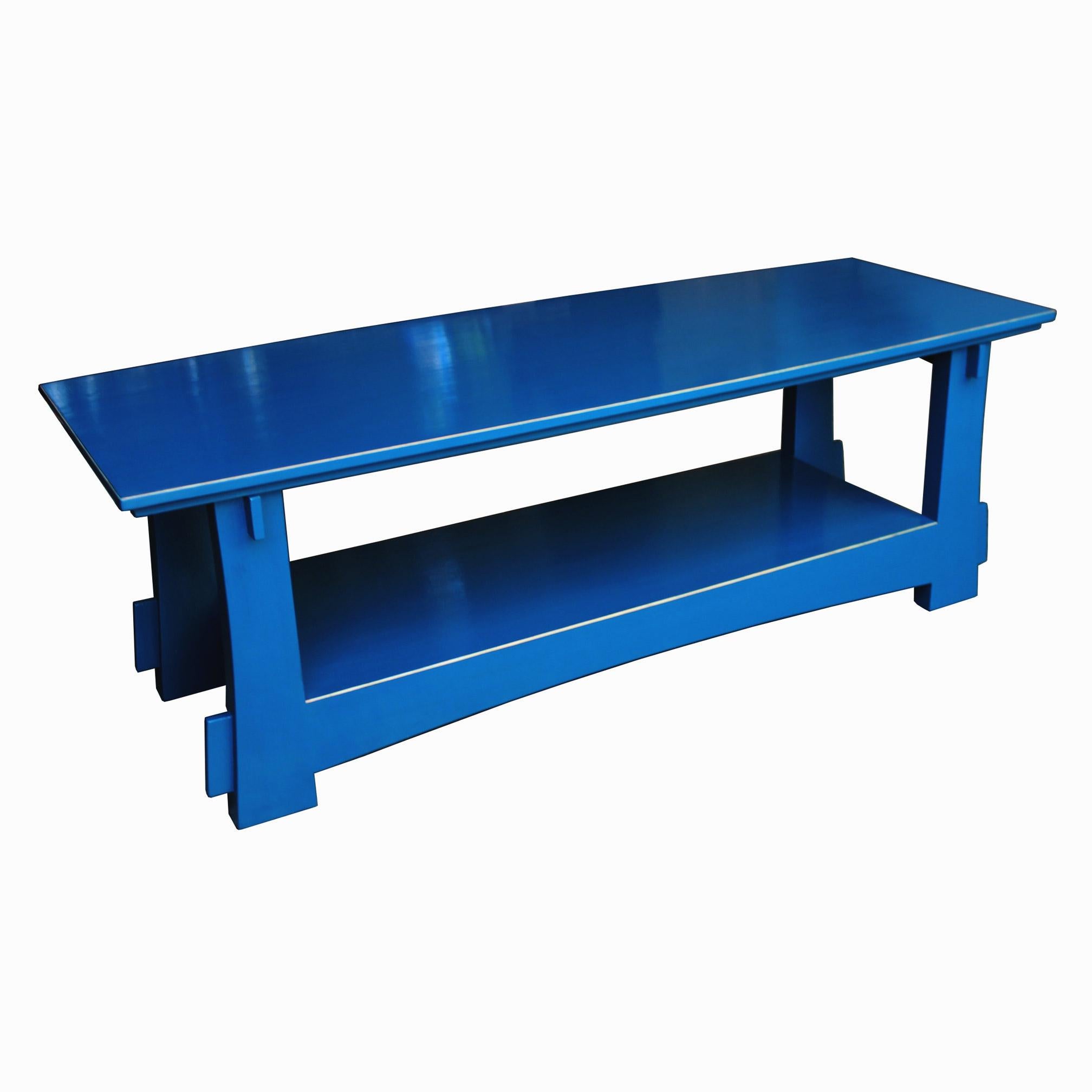 Custom handcrafted blue lacquer rectangular coffee table with shelf. Place in front of a couch with books and accessories on top.