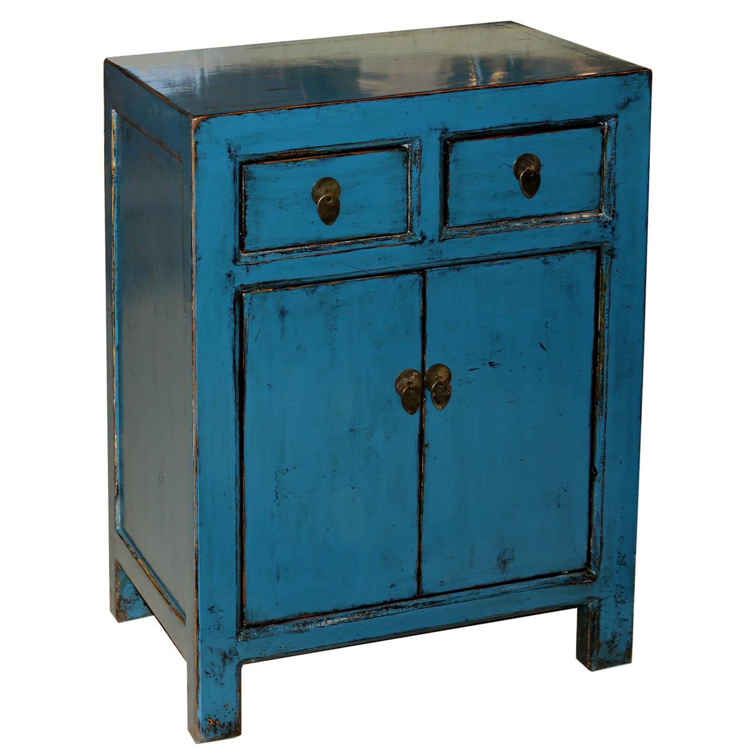 Contemporary blue lacquer side chest with clean lines and exposed wood edges provides a bedroom with a pop of color when placed on either side of a bed with a lamp and books on top. Priced individually not as a pair.