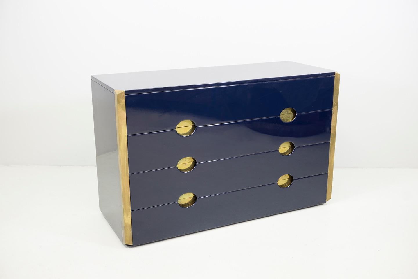 Elegant sIdeboard with three spacious drawers, wooden corpus with a glossy lacquered surface in dark blue and brass elements. 
Designed by Dominioni, manufactured by Azucena.