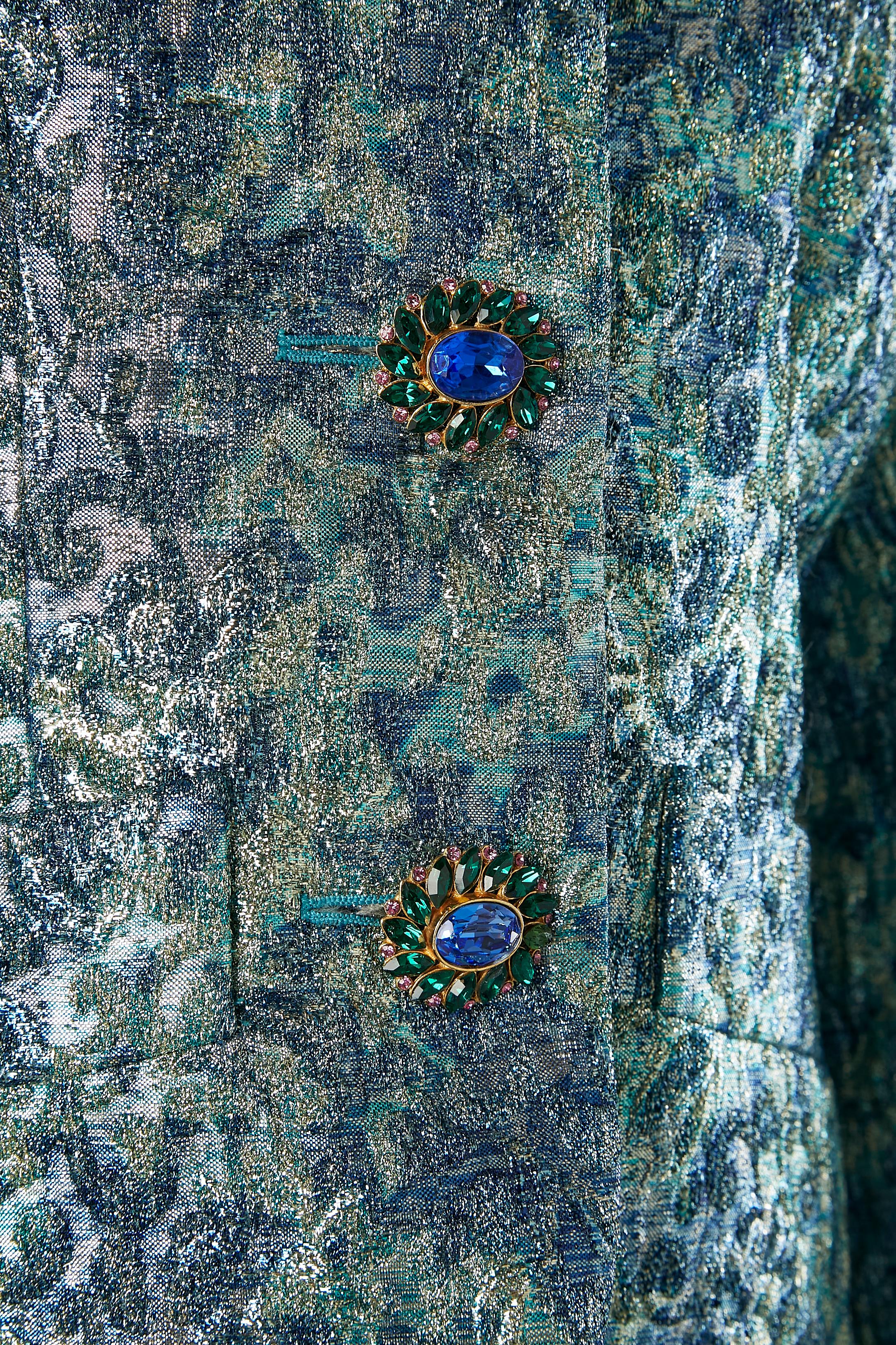 Blue silk and lurex brocade evening jacket with jewel buttons. 
Silk satin lining.
SIZE 38 (M) 
