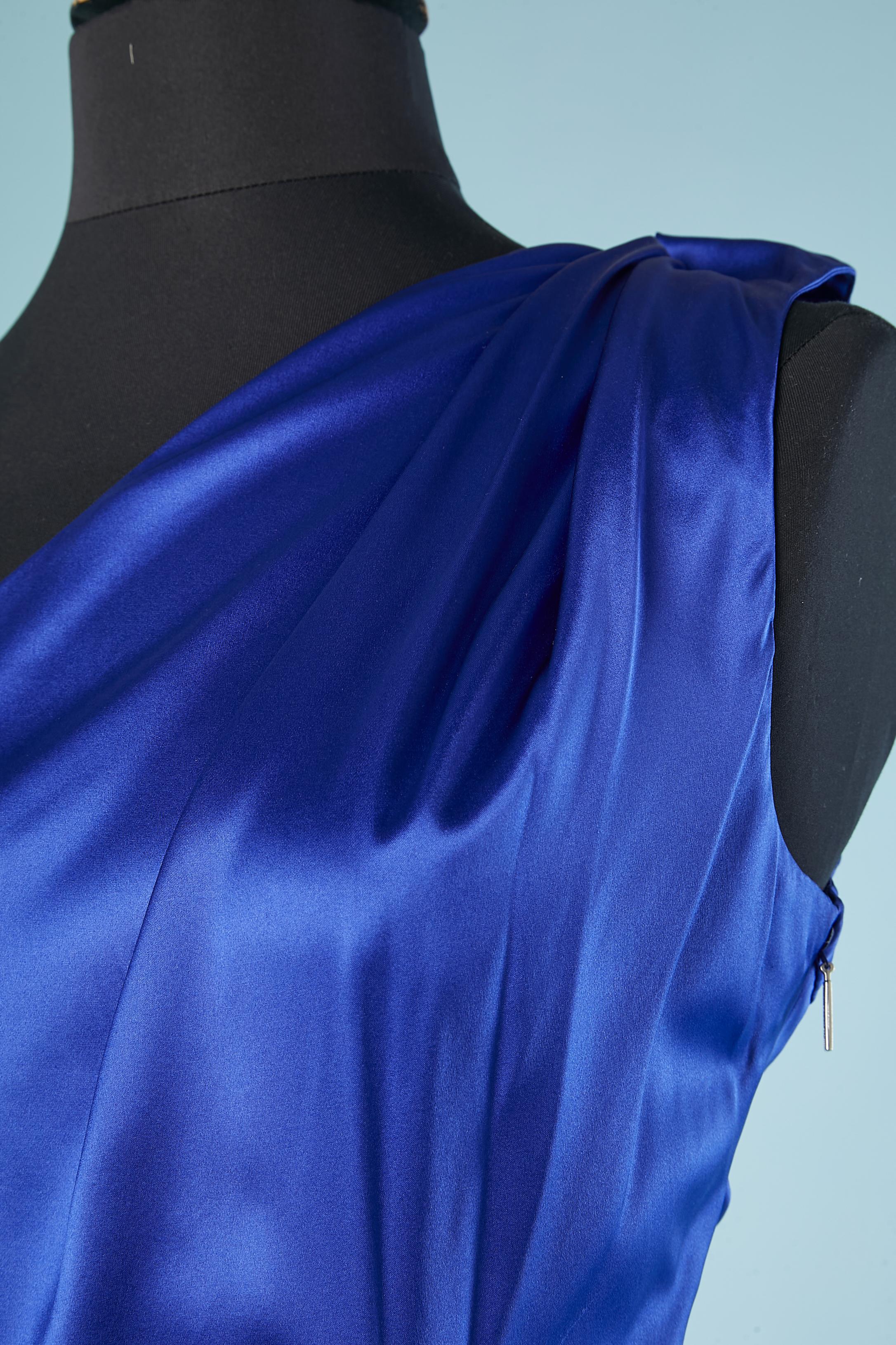 Blue silk asymmetrical cocktail dress with silver metal brooch. Drape. Zip and hook&eye on the left side. 
Authenticity hologram.
Size 44(It) 40 (Fr) 8 (Us) 