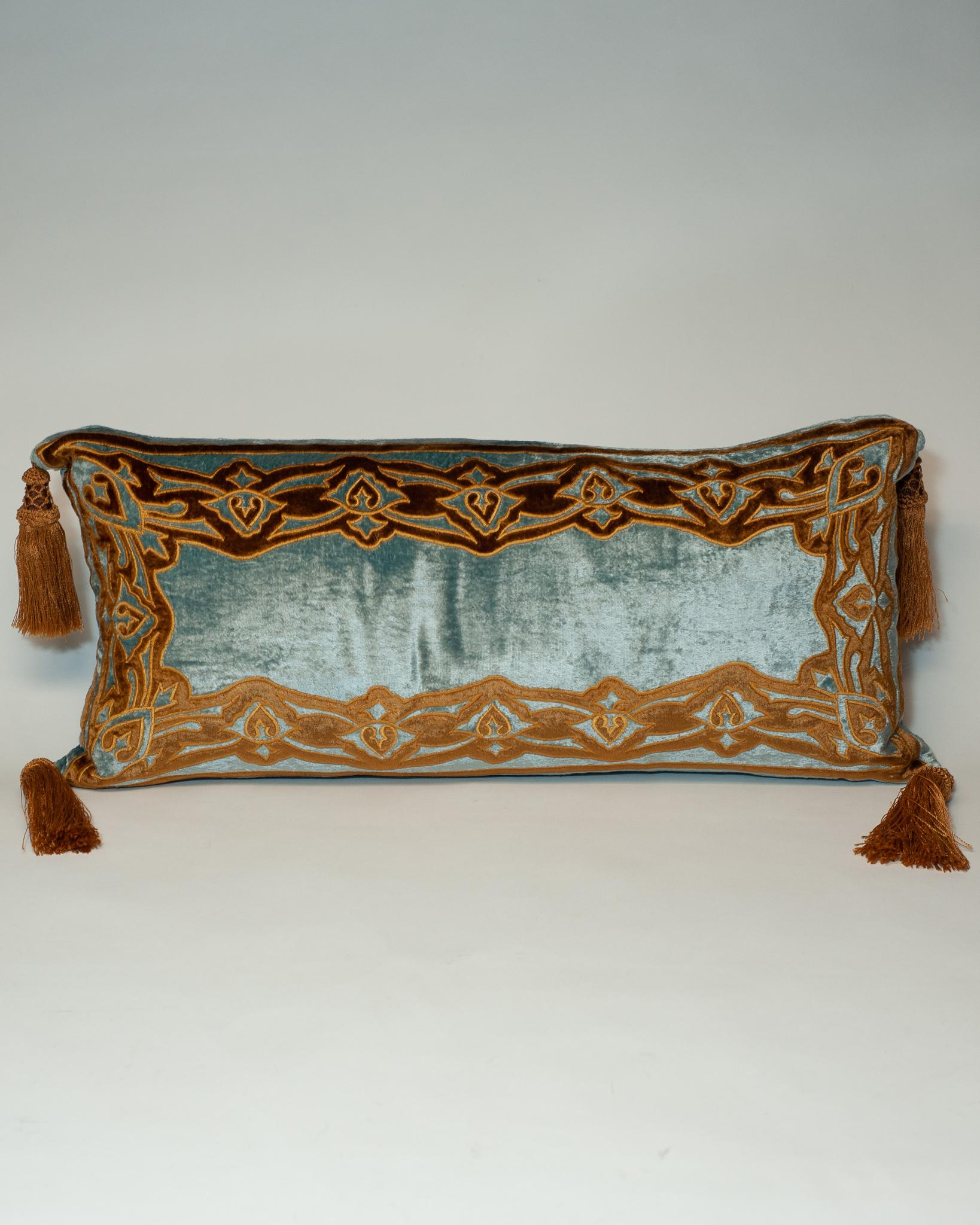 A blue cut velvet pillow on crème silk with gold embroidery, tassels and down filled, made in Italy.
