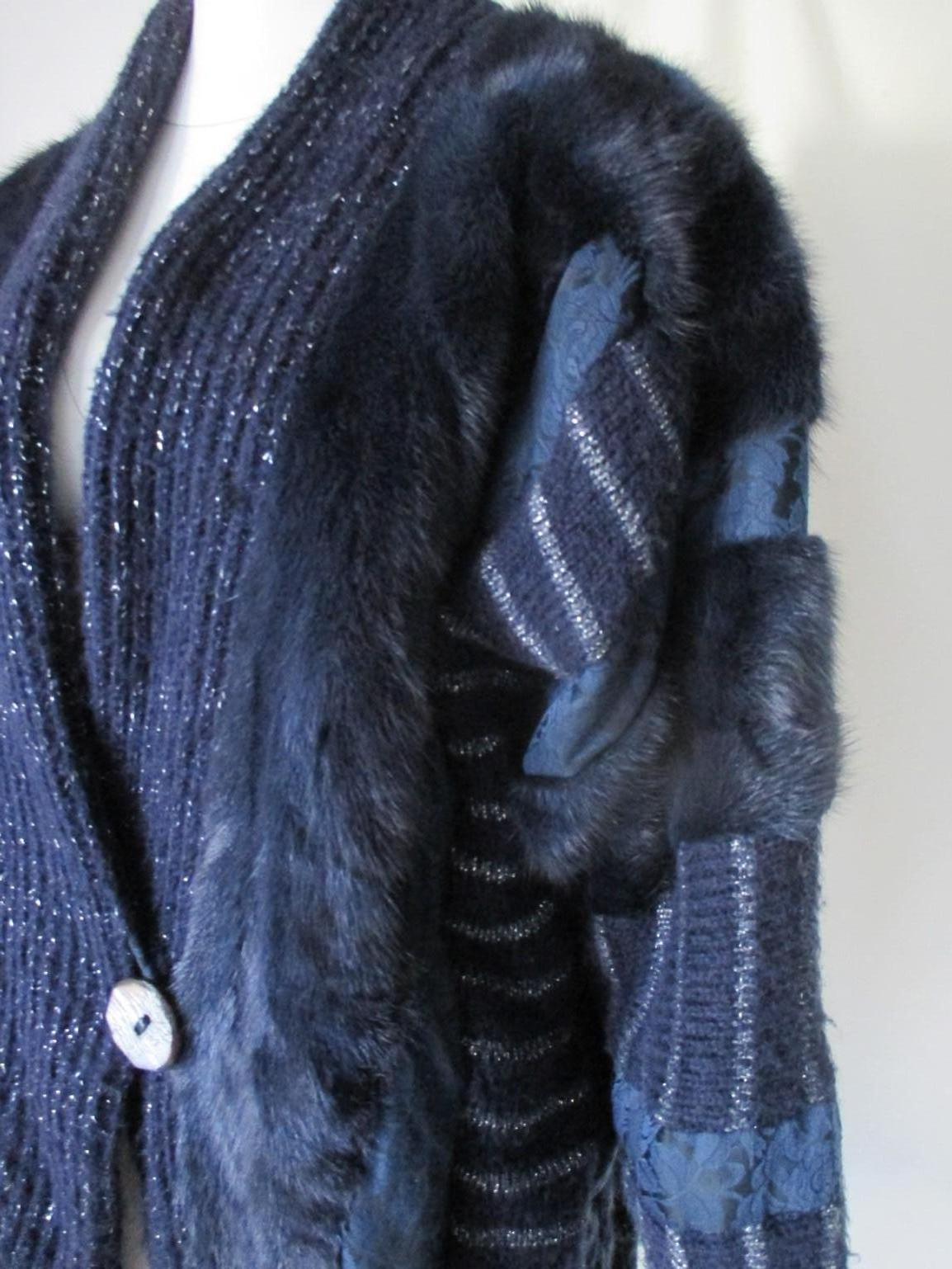 Fabulous original vintage 80/90s wool coat embroidered with silver / blue wool and blue dyed mink fur with 1 button closure and 2 pockets.
Good pre-owned condition 
Size fits as medium to large, but can be worn oversized at a smaller person, see