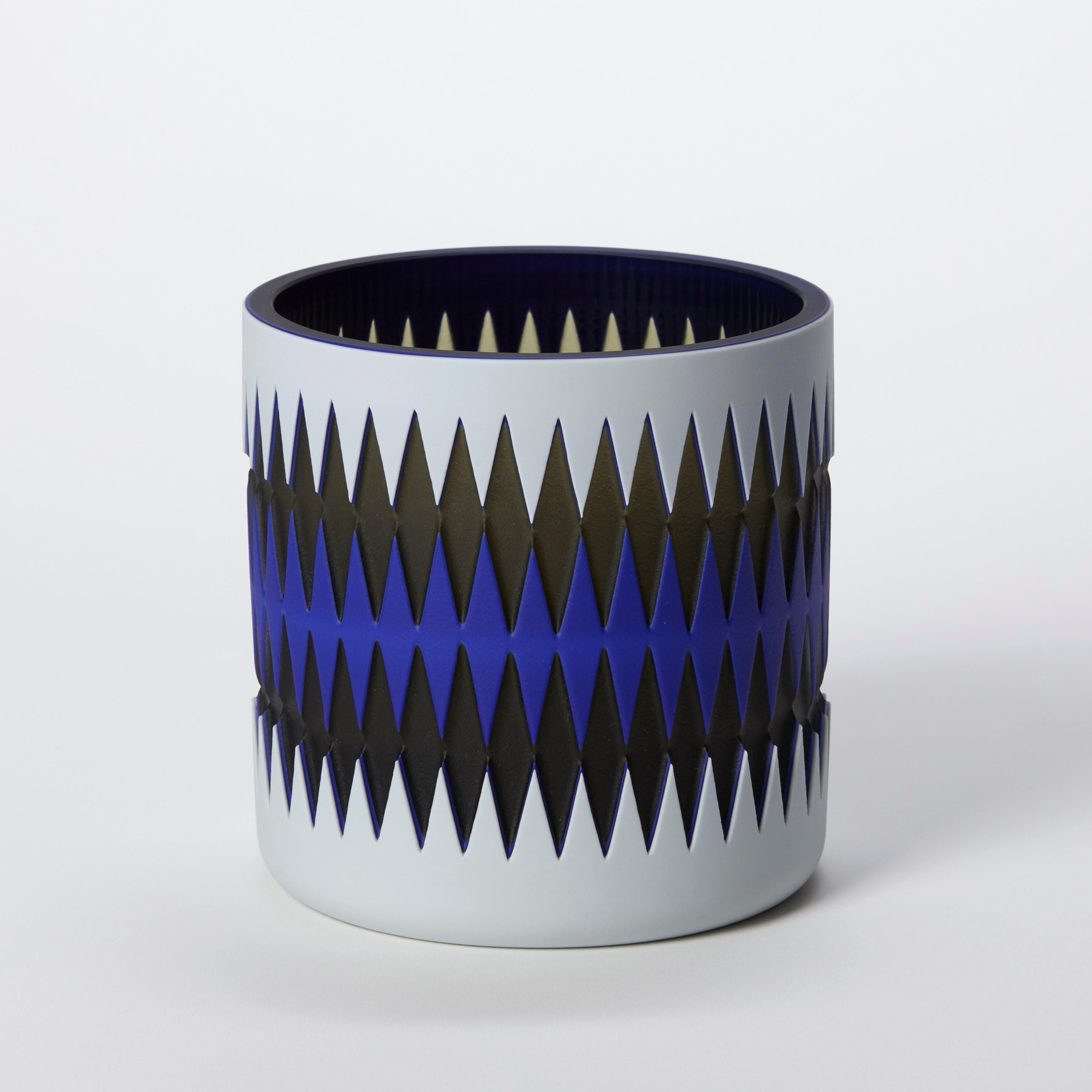 ‘Blue Skies' is a unique glass sculptural vessel by the British artist, Sarah Wiberley. Handblown from layers of colour, the precise patterns shown are created by masking and sandblasting different areas, with each configuration revealing a
