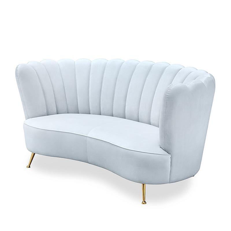 Sofa blue sky with structure in solid wood
and covered with blue sky velvet fabric.
Feet in gold satinated metal.