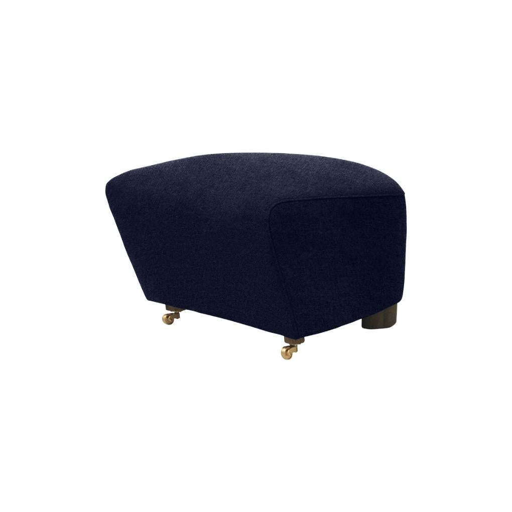 Blue smoked oak Hallingdal the tired man footstool by Lassen.
Dimensions: W 55 x D 53 x H 36 cm. 
Materials: Textile.

Flemming Lassen designed the overstuffed easy chair, The Tired Man, for The Copenhagen Cabinetmakers’ Guild Competition in
