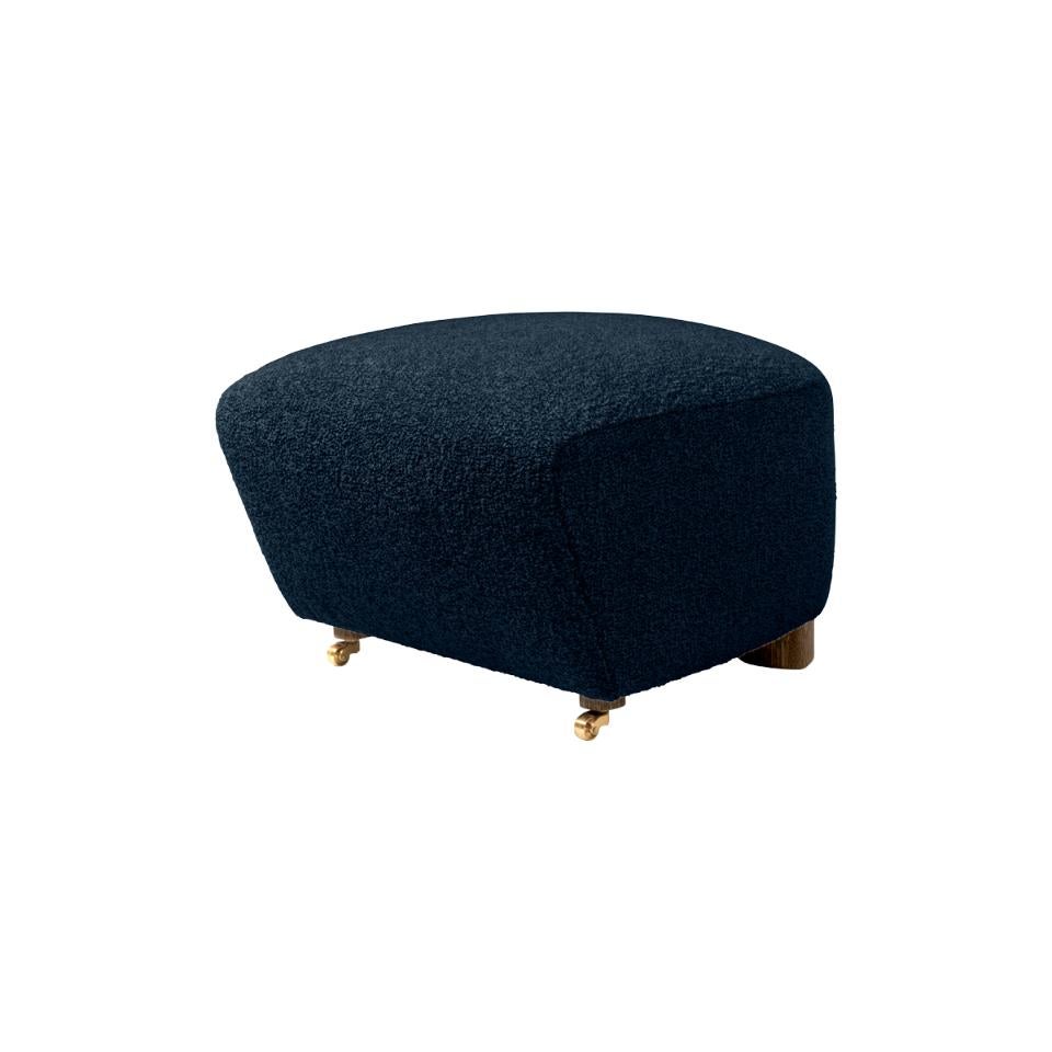 Blue smoked oak sahco zero the tired man footstool by Lassen.
Dimensions: W 55 x D 53 x H 36 cm. 
Materials: Textile.

Flemming Lassen designed the overstuffed easy chair, The Tired Man, for The Copenhagen Cabinetmakers’ Guild Competition in