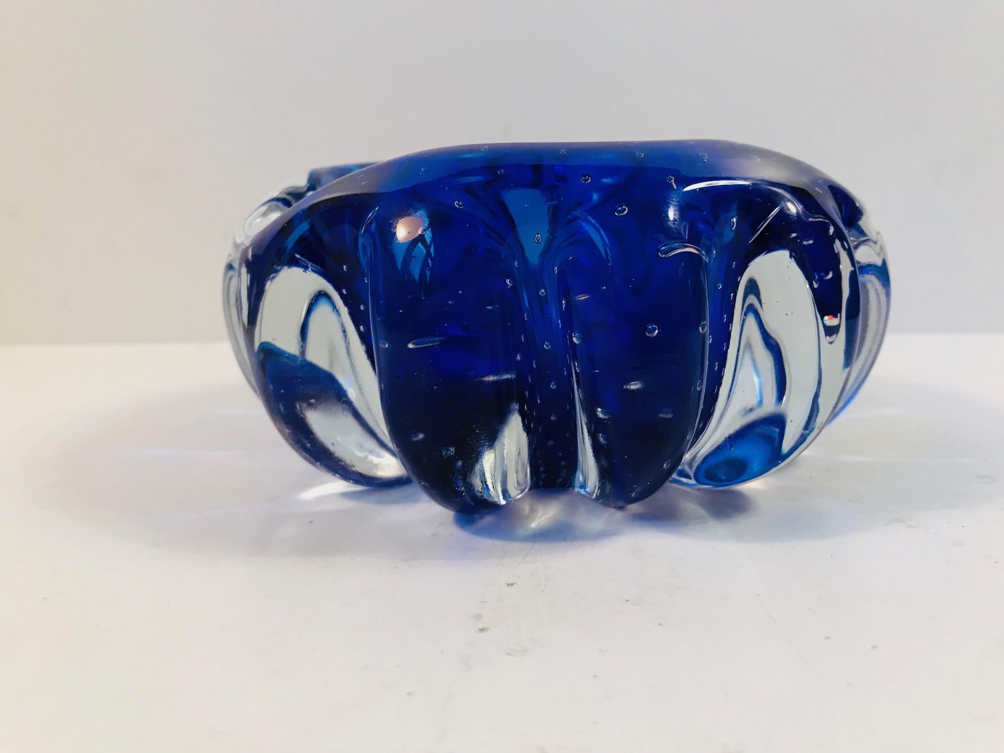 This blue Sommerso ashtray comes with controlled air-bubbles. It was made in Murano, Italy during the late 1950s or early 1960s.