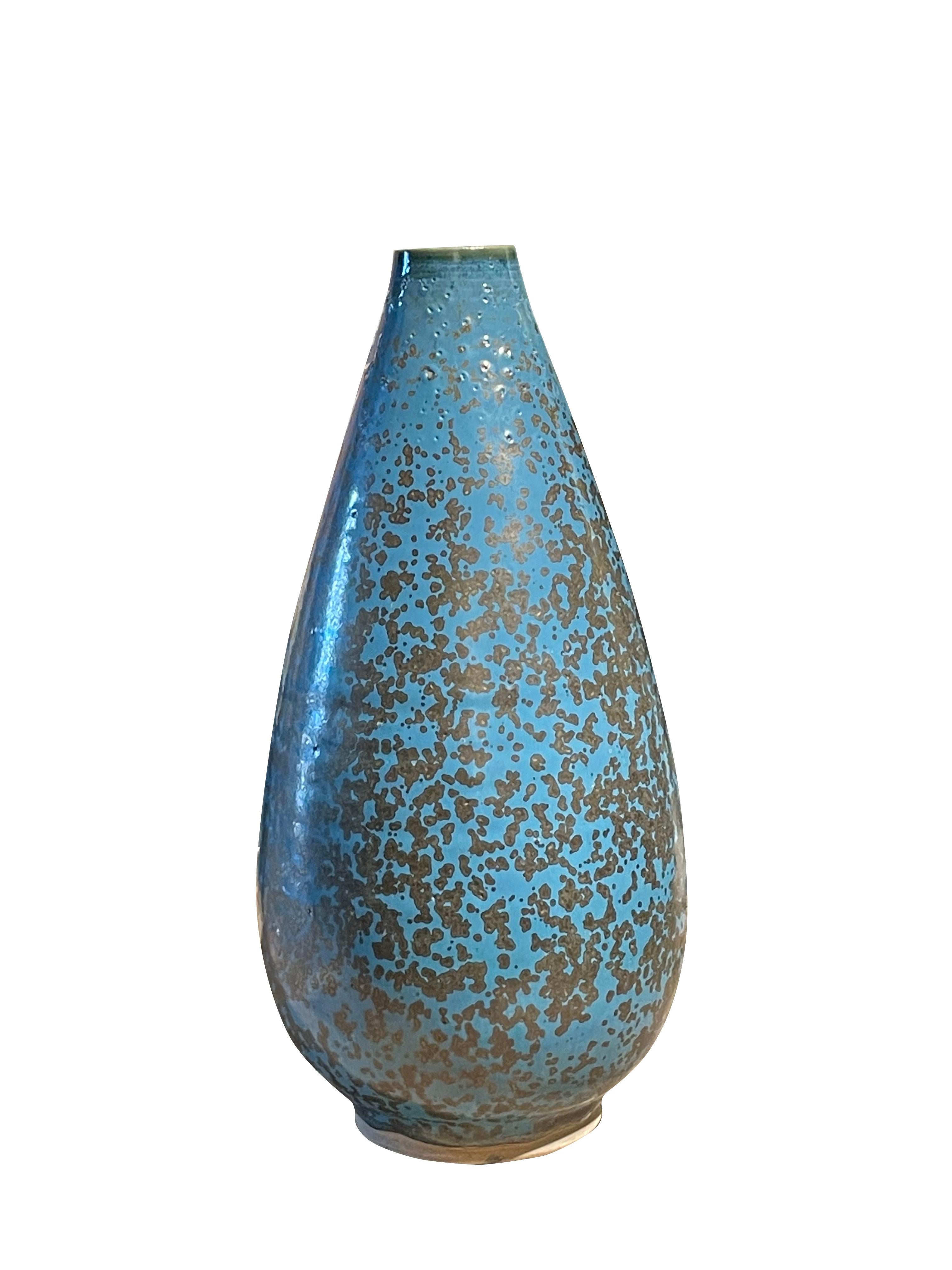 Contemporary Chinese vase with speckle blue glaze.
Tear drop shape.
Can hold water.
Part of large collection.
ARRIVING NOVEMBER.