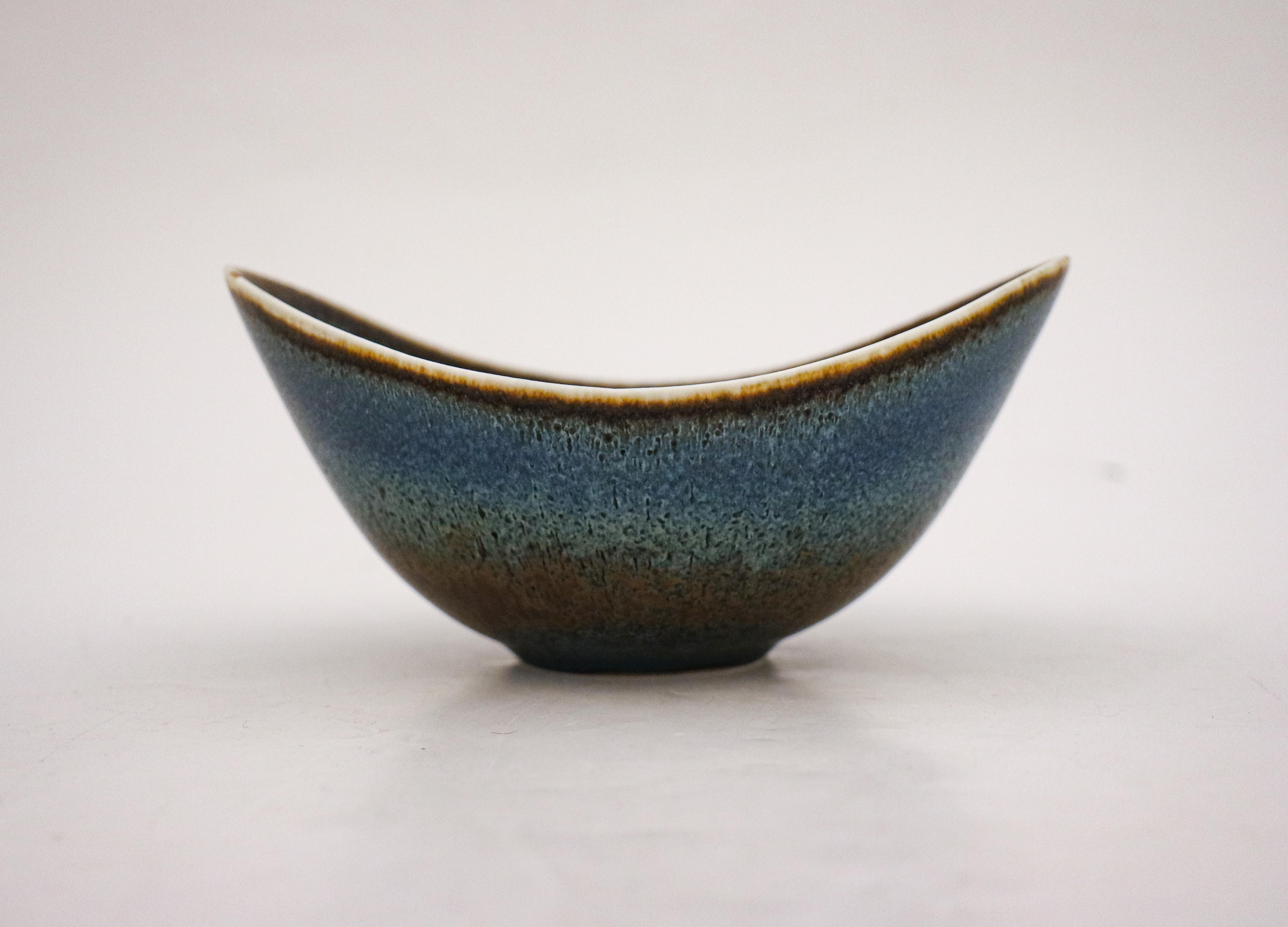 A blue speckled bowl designed by Gunnar Nylund at Rörstrand, the bowl is 8 cm (3.2