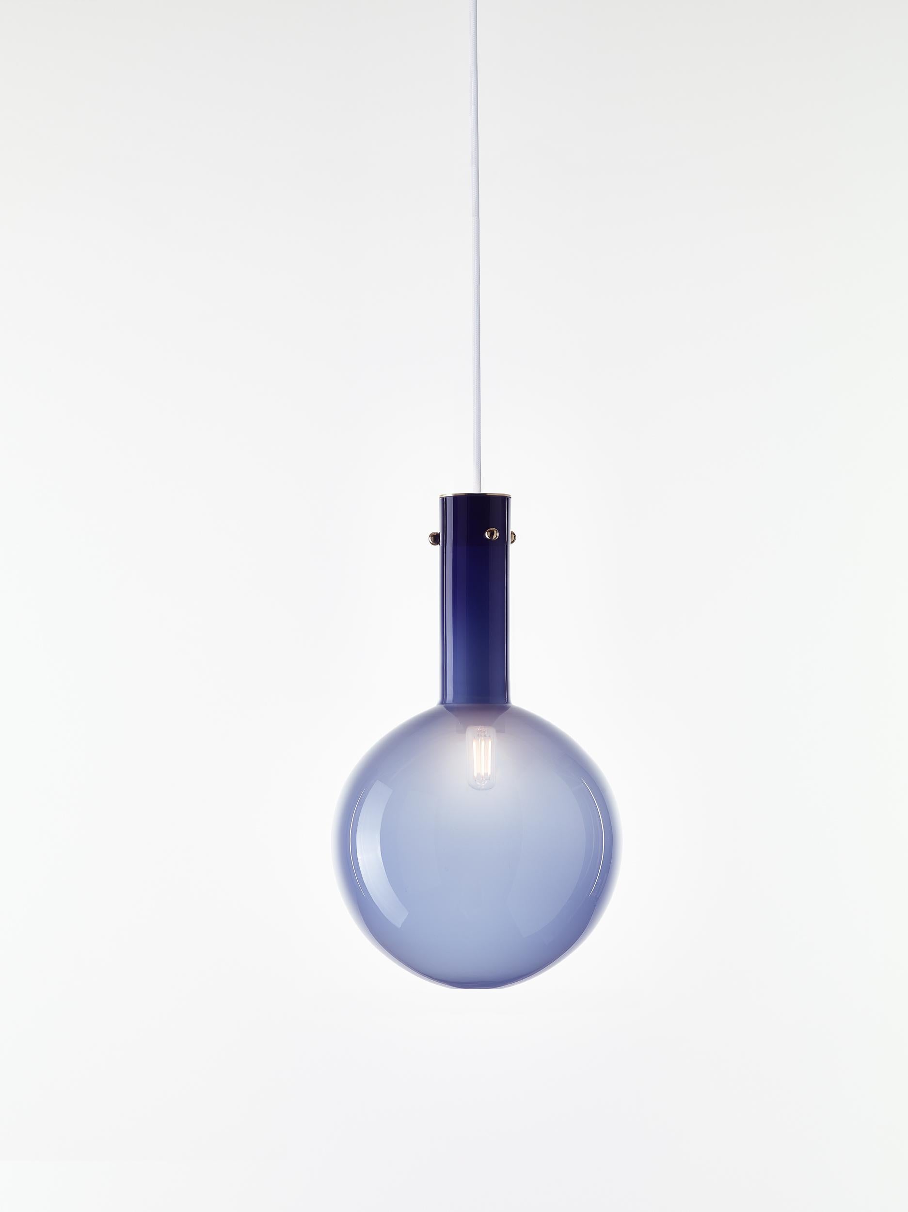 Blue Sphaerae pendant light by Dechem Studio
Dimensions: D 20 x H 180 cm
Materials: brass, metal, glass.
Also available: different finishes and colors available.
Only one homogenous piece of hand blown glass creates the main body of Sphaerae