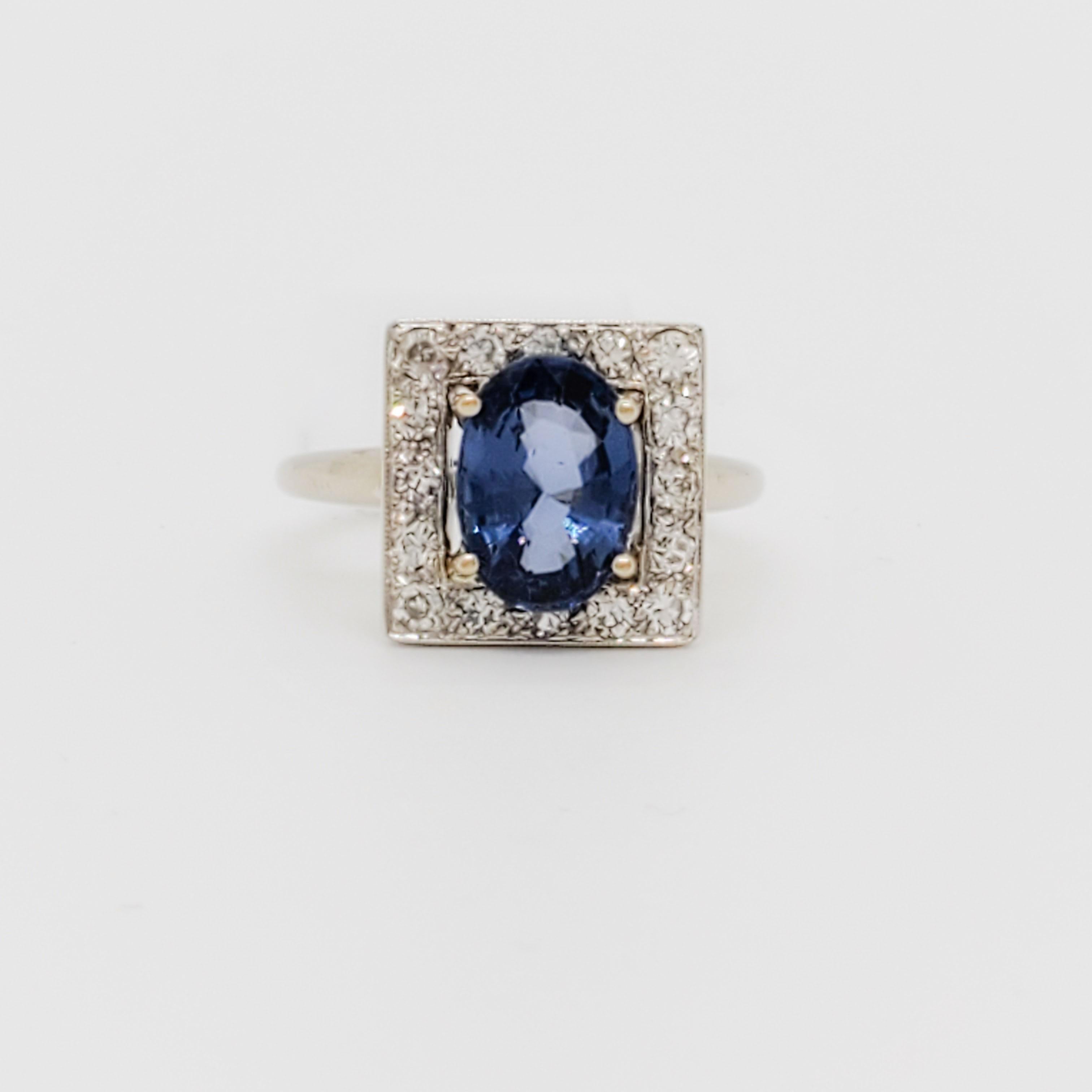 Beautiful 2.32 ct. blue spinel oval with 0.20 ct. good quality white diamond rounds.  Handmade in 14k white gold.  Ring size 6.75.