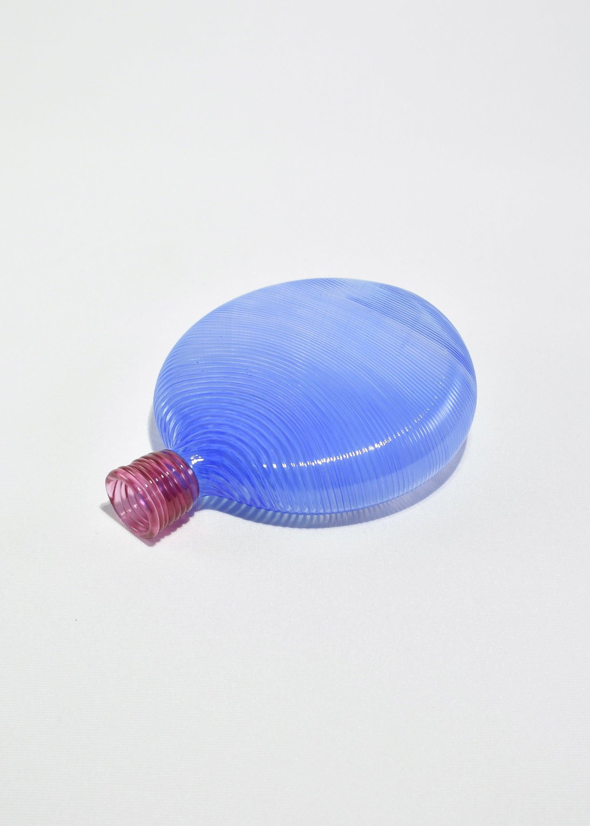 Beautiful blown glass stem vase in blue with pink detail. Signed on base.