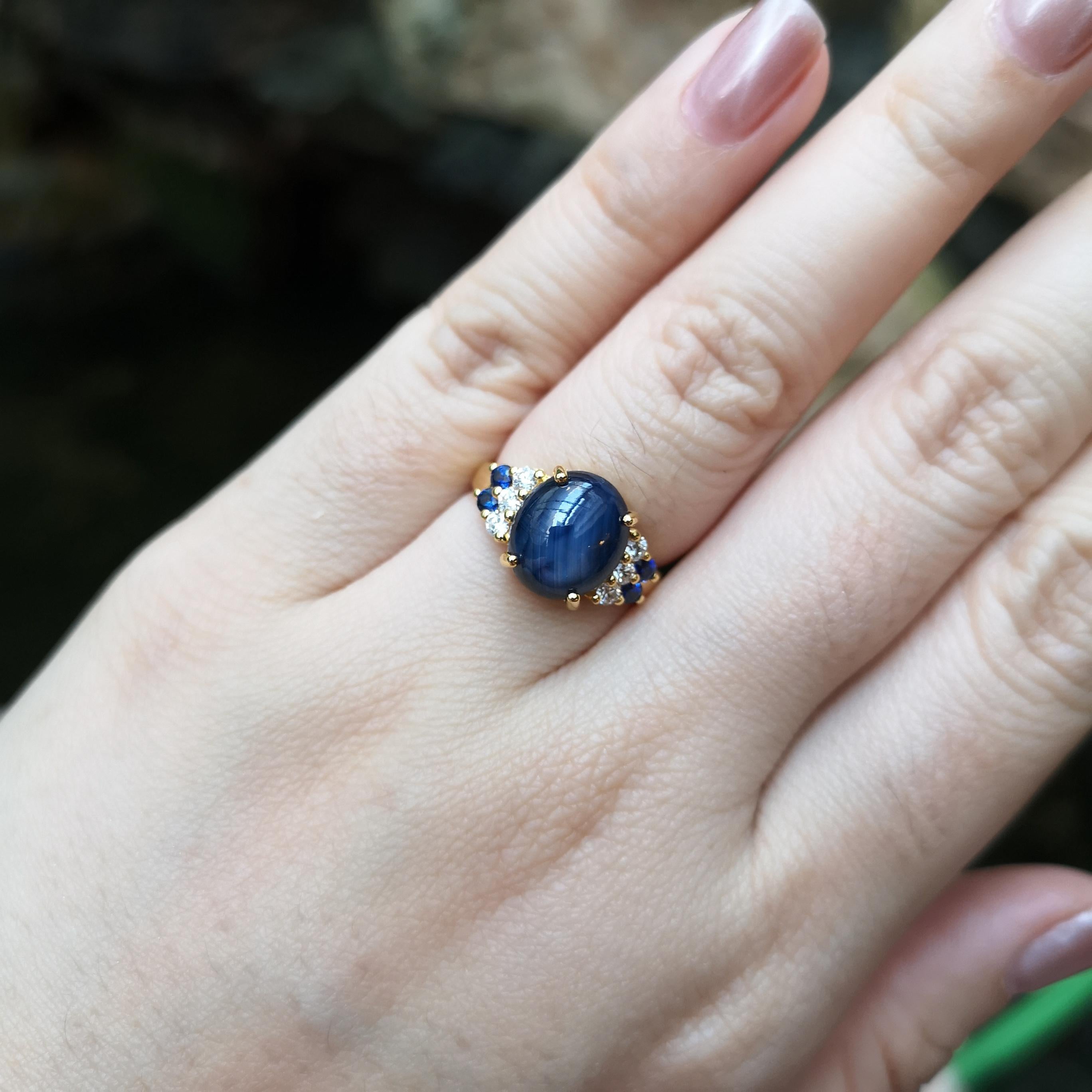 Blue Star Sapphire 7.48 carats, Blue Sapphire 0.24 carat and Diamond 0.24 carat Ring set in 18K Gold Settings

Width:  1.7 cm 
Length: 1.1 cm
Ring Size: 54
Total Weight: 4.72 grams

