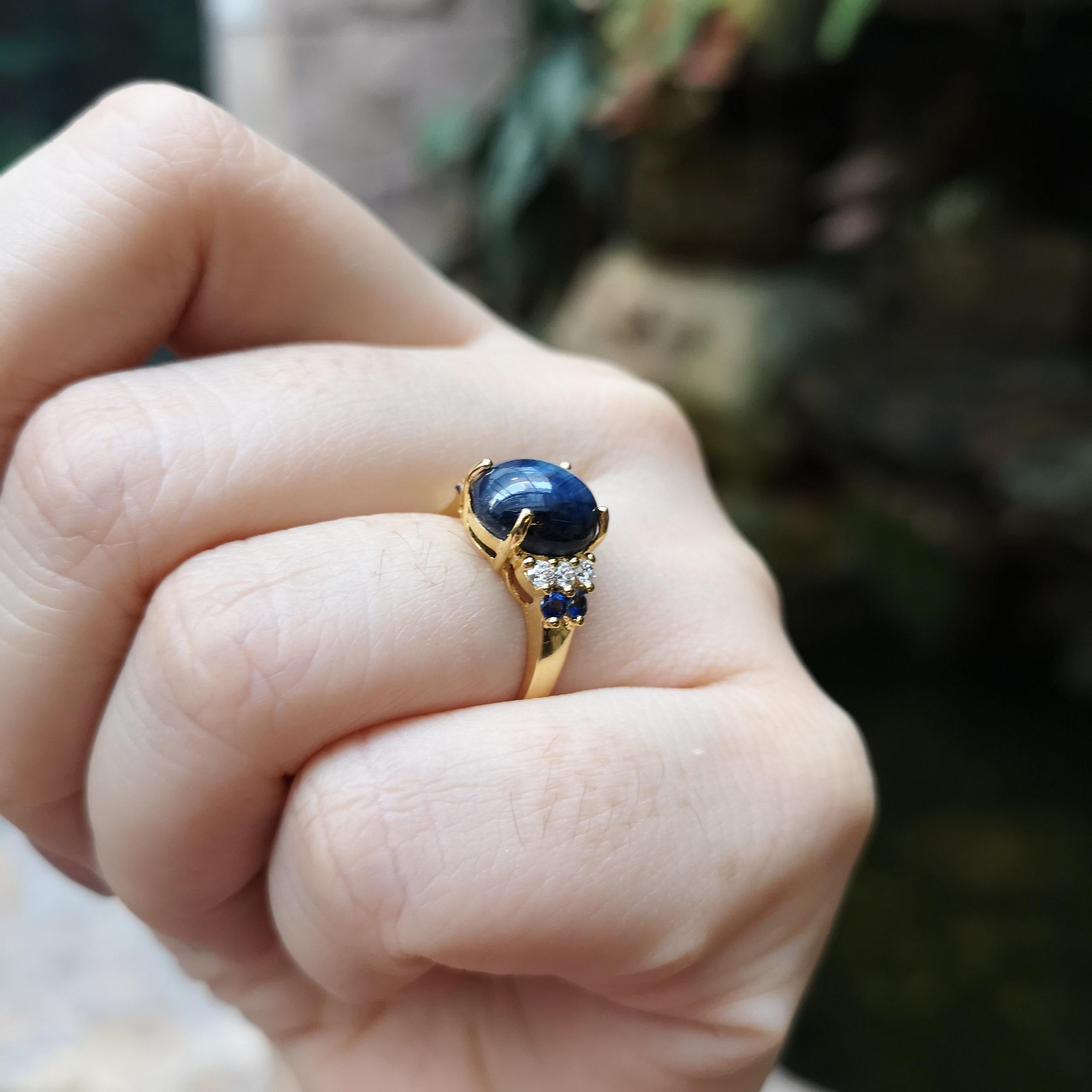 Contemporary Blue Star Sapphire, Blue Sapphire and Diamond Ring set in 18K Gold Settings For Sale
