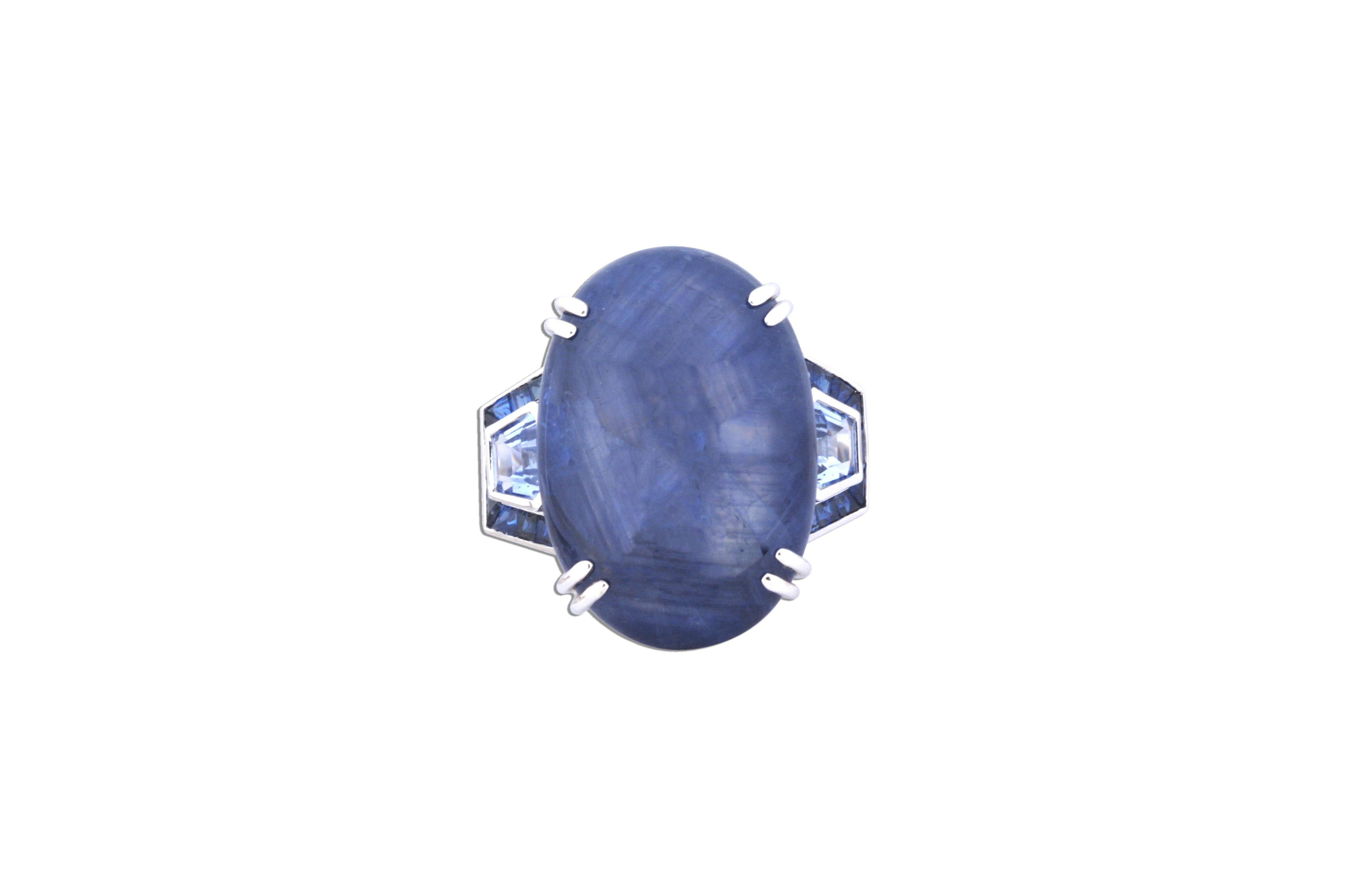 Blue Star Sapphire 48.18 carats, Blue Sapphire 1.73 carats, Blue Sapphire 1.51 carats, Blue Sapphire 2.36 carats Ring in 18 karat White Gold Settings

Width: 3.0 cm
Length: 2.8 cm
Ring Size: 57
Total Weight: 26.13 grams

