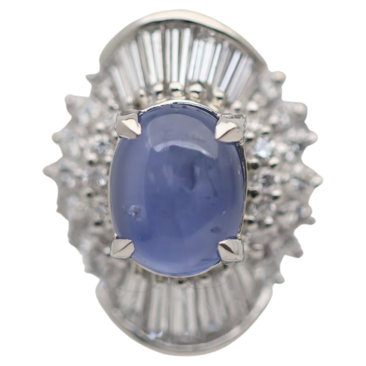 Bague en platine avec saphir bleu étoilé et diamants