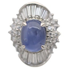 Platinring mit blauem Sternsaphir und Diamant