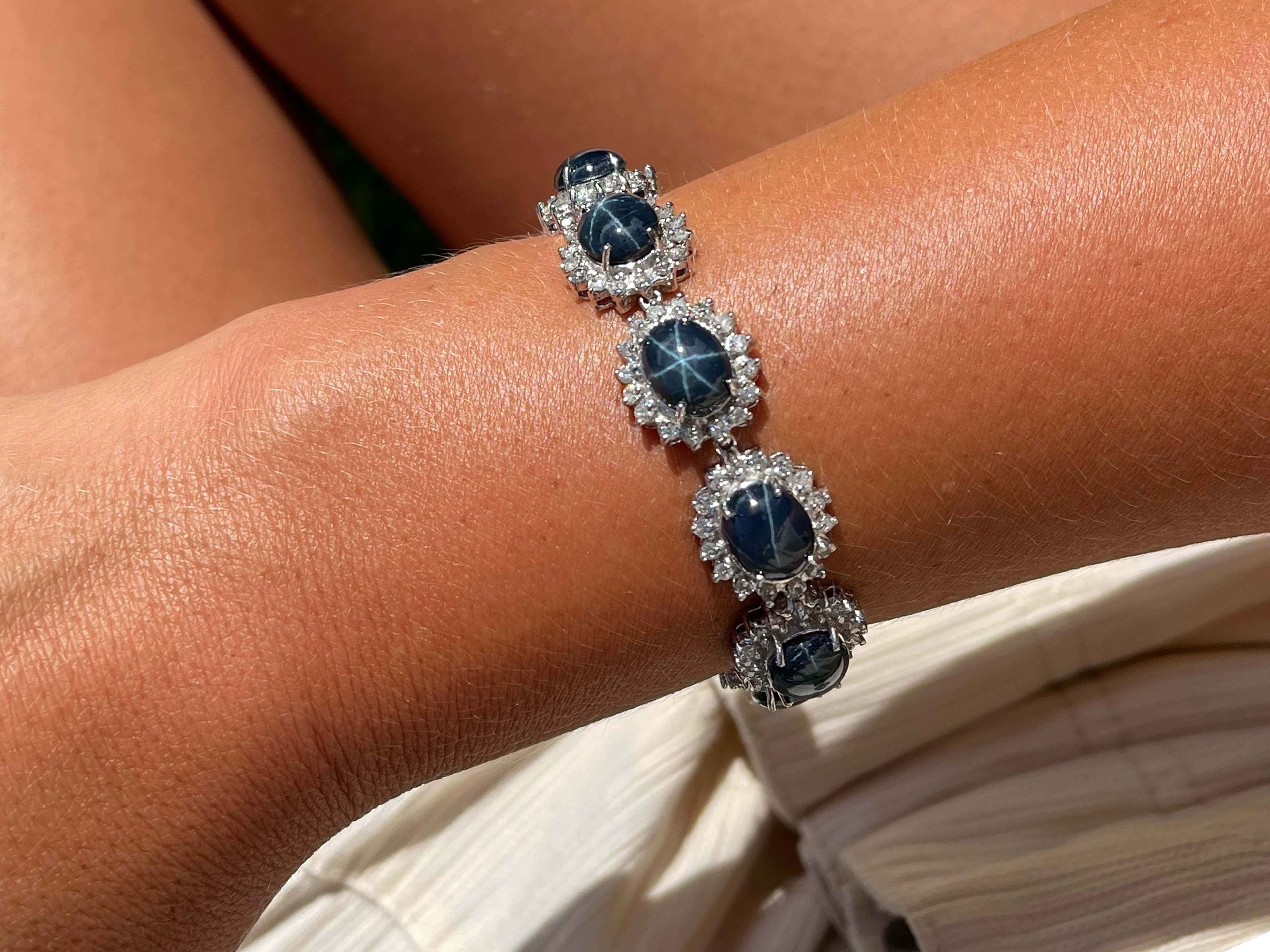 Bracelet Specifications:

Metal: 14k White Gold

Gemstones: blue star sapphires 

Sapphire Carat Weight: 56.40 carats

Sapphire Count: 11

Diamond Count: 176

Diamond Carat Weight: 5.00

Diamond Color: F-G

Diamond Clarity: SI2-I1

Bracelet Length:
