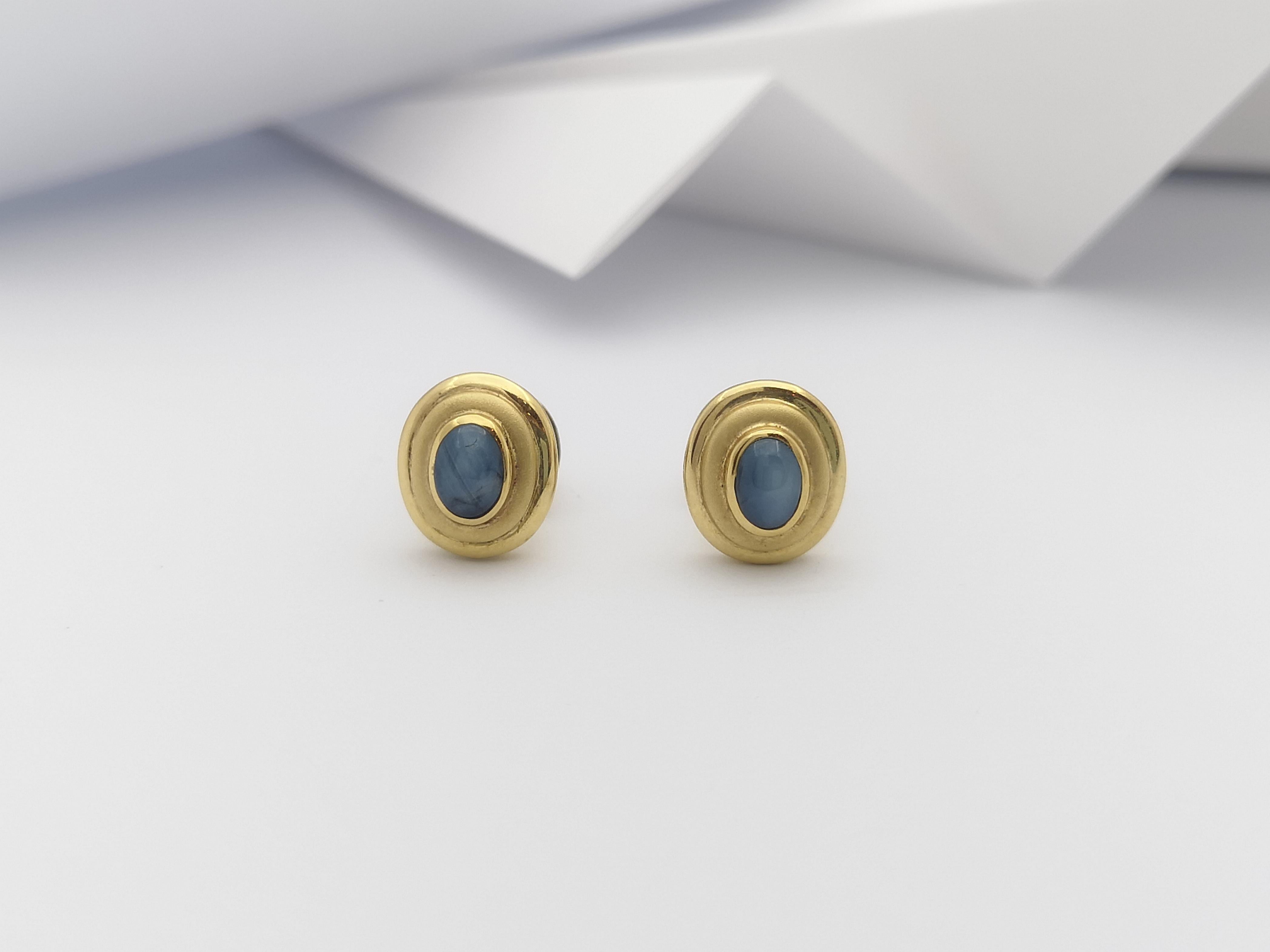 Contemporary Blue Star Sapphire  Earrings set in 18 Karat Gold Settings For Sale