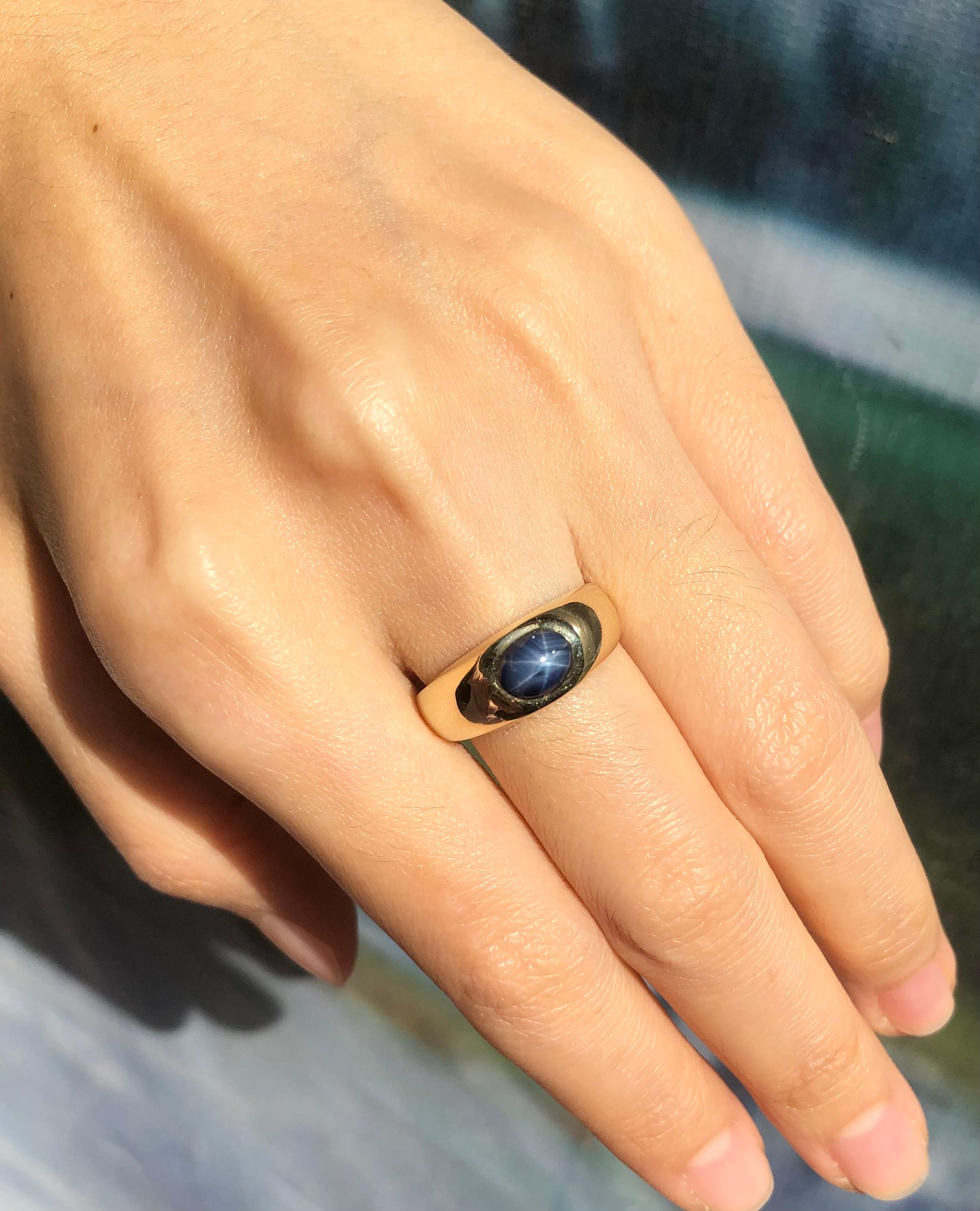 Contemporary Blue Star Sapphire Ring Set in 14 Karat Gold Settings  For Sale