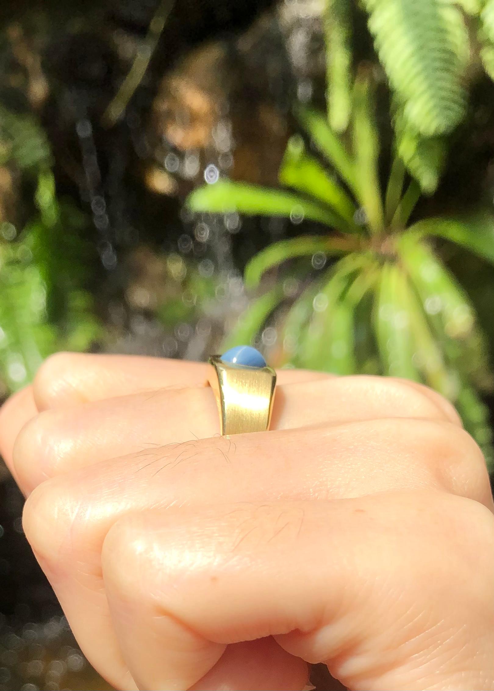 Contemporary Blue Star Sapphire Ring Set in 14 Karat Gold Settings For Sale