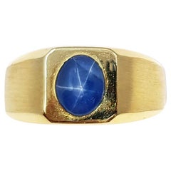 Blue Star Sapphire Ring Set in 14 Karat Gold Settings