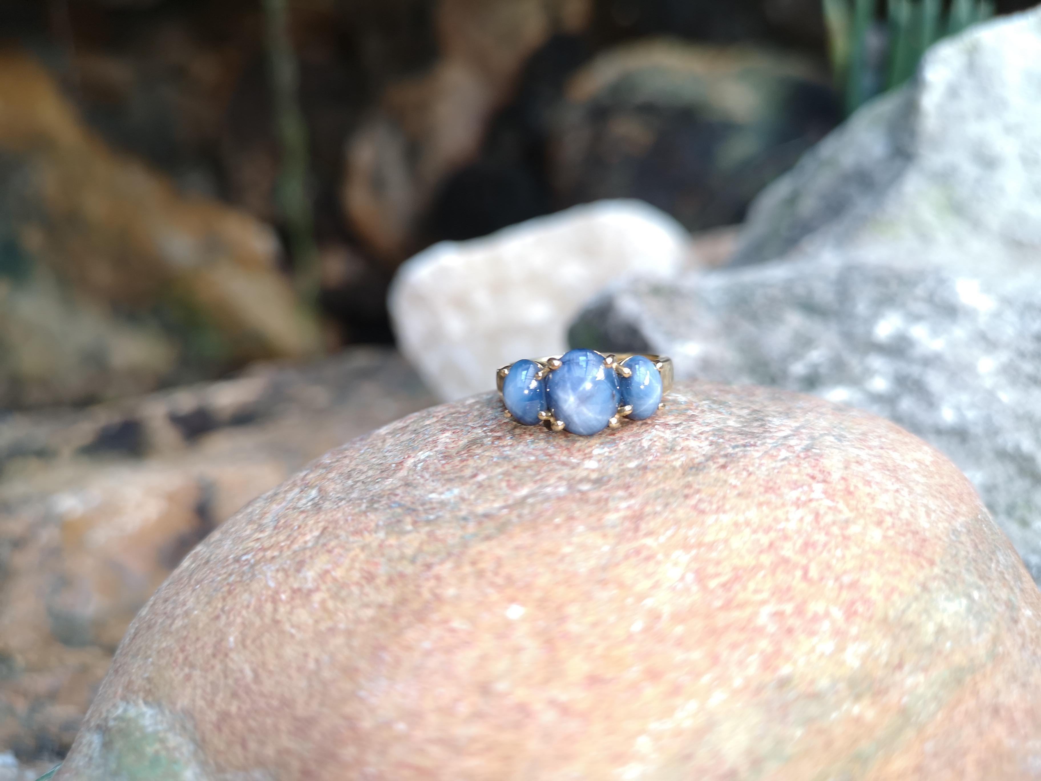 Contemporary Blue Star Sapphire Ring Set in 18 Karat Gold Settings