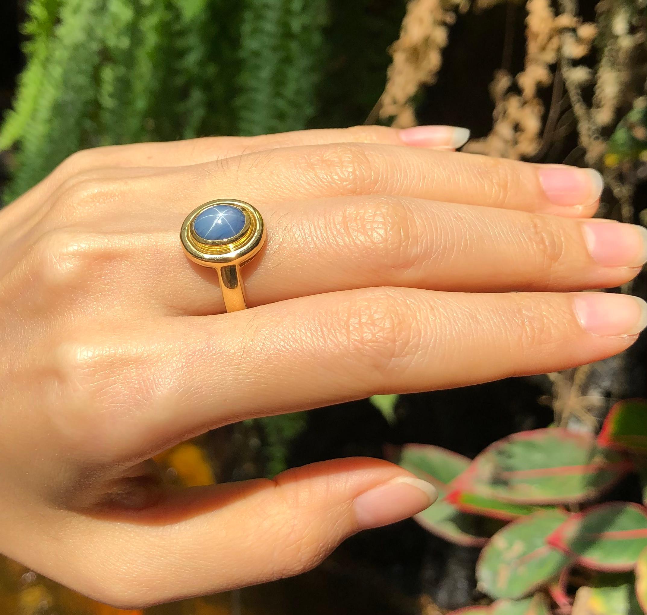 Cabochon Blue Star Sapphire Ring Set in 18 Karat Gold Settings