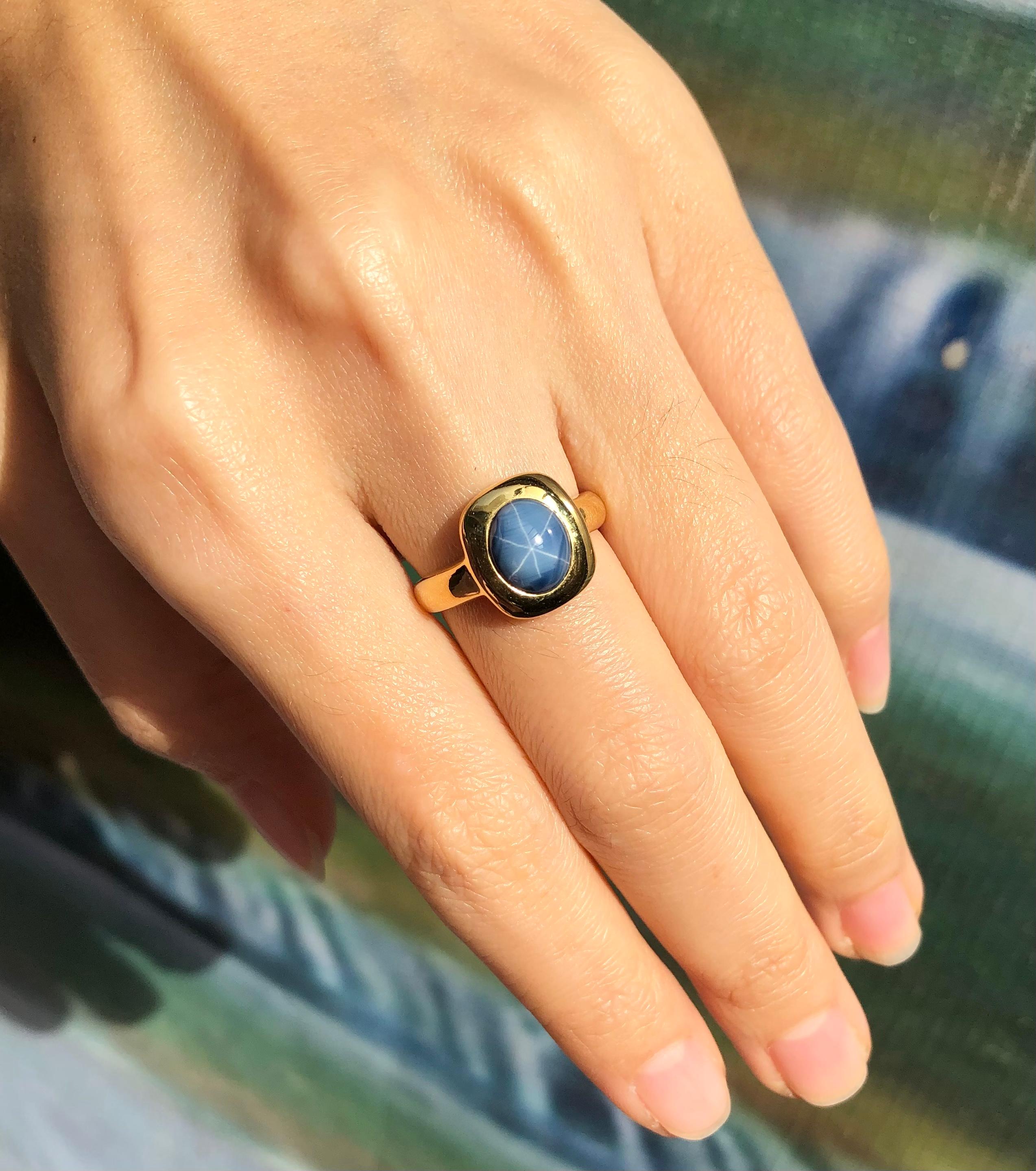 Cabochon Blue Star Sapphire Ring Set in 18 Karat Gold Settings For Sale