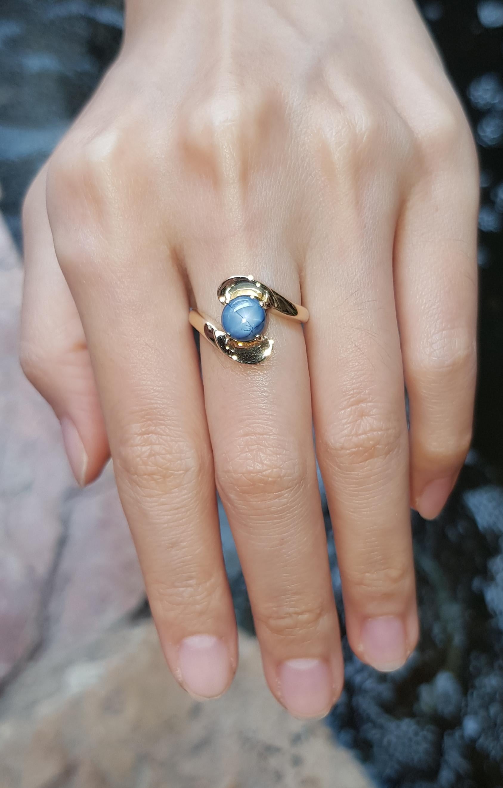 Cabochon Blue Star Sapphire Ring Set in 18 Karat Gold Settings For Sale