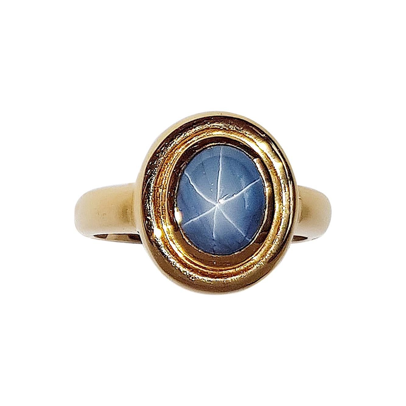 Blue Star Sapphire Ring Set in 18 Karat Gold Settings