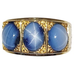 Blue Star Sapphire Ring set in 18 Karat Gold Settings