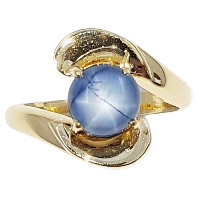 Blue Star Sapphire Ring Set in 18 Karat Gold Settings