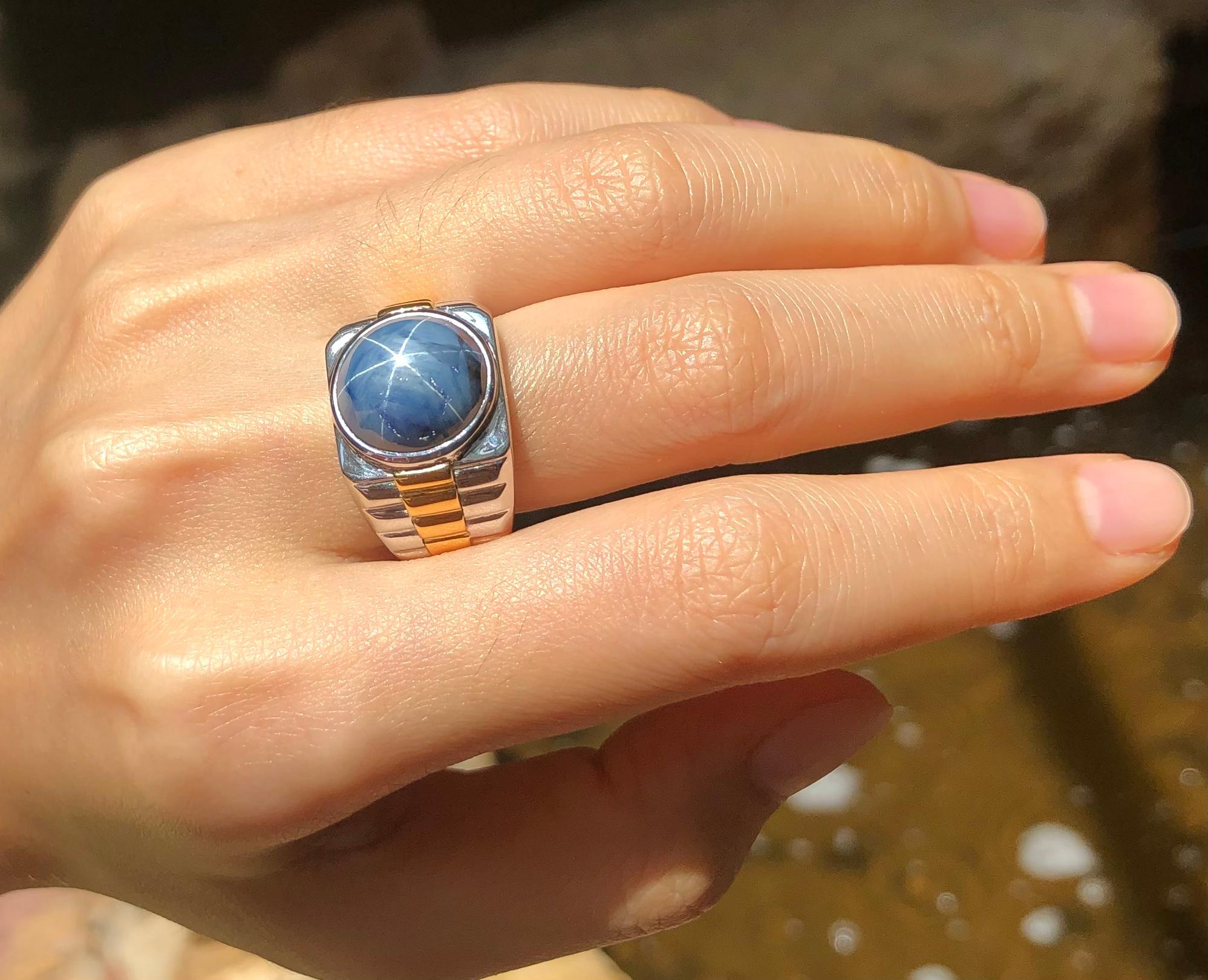 Contemporary Blue Star Sapphire Ring Set in 18 Karat White Gold Settings For Sale