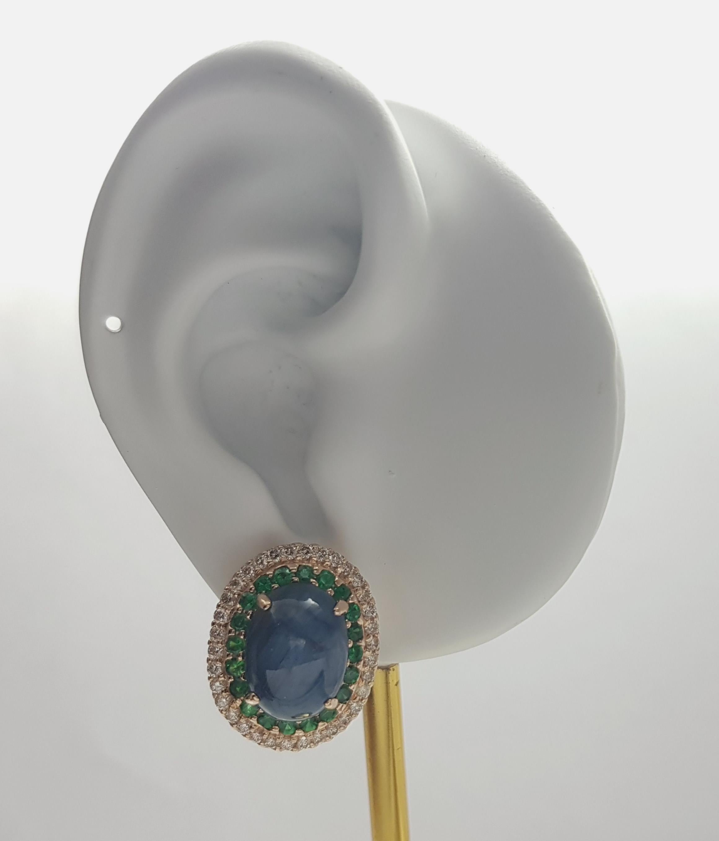 Blue Star Sapphire 17.32 carats, Tsavorite 1.48 carats and Brown Diamond 1.19 carats Earrings set in 18K Rose Gold Settings

Width: 1.8 cm 
Length: 2.2 cm
Total Weight: 14.67 grams


