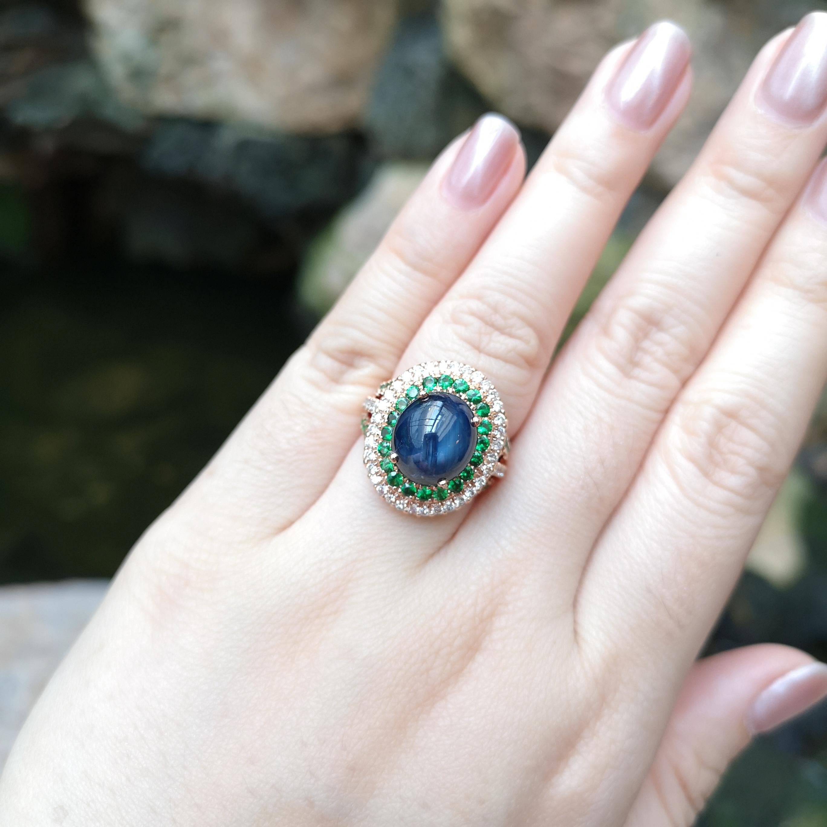 Blue Star Sapphire 9.32 carats, Tsavorite 1.08 carats and Brown Diamond 0.63 carat Ring set in 18K Rose Gold Settings

Width:  1.7 cm 
Length: 2.2 cm
Ring Size: 54
Total Weight: 10.51 grams

