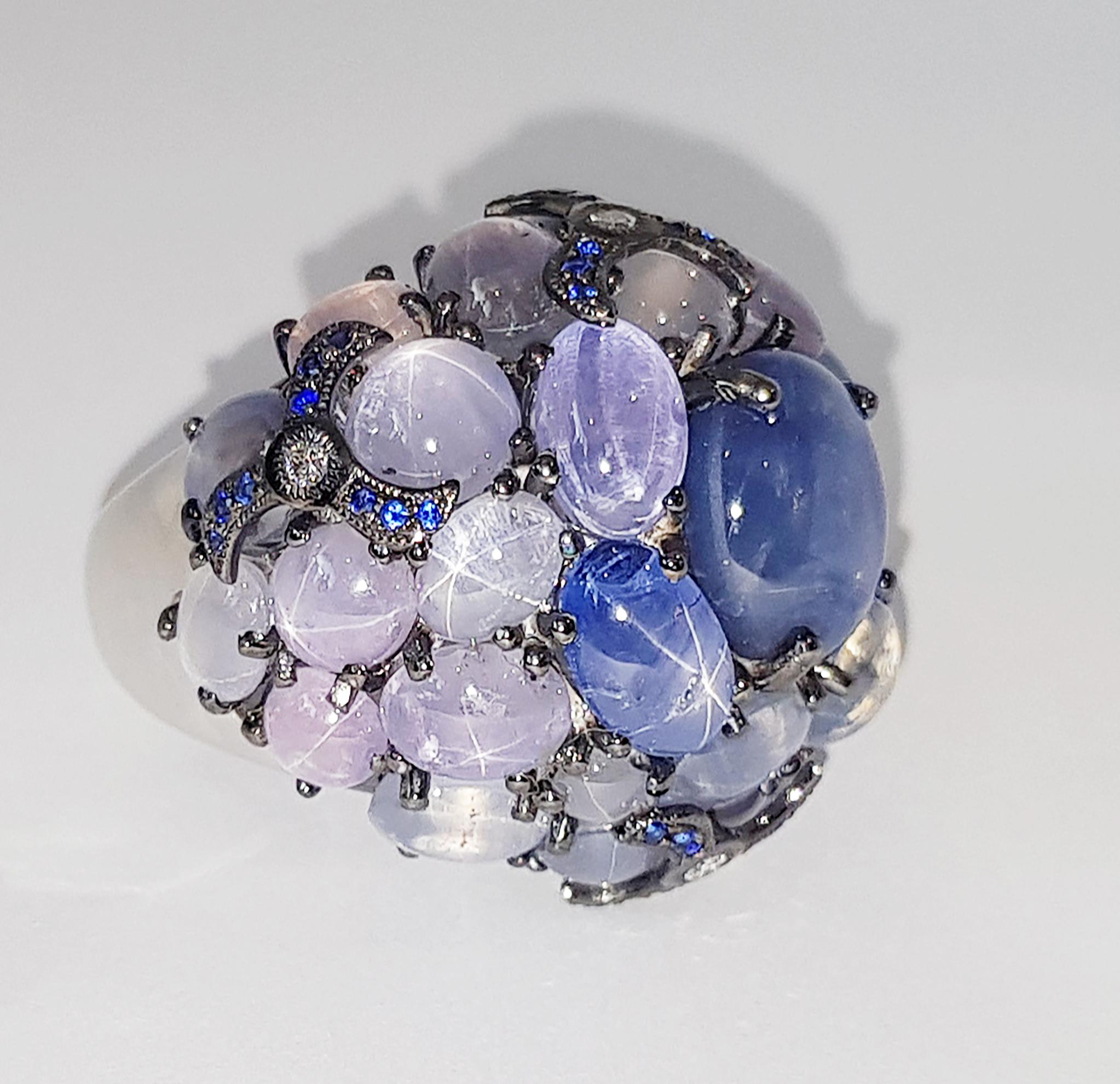 Blue Star Sapphire 42.51 carats with Blue Sapphire 0.22 carat with Diamond 0.08 carat Ring set in 18 Karat White Gold Settings

Width:  2.9 cm 
Length:  2.5 cm
Ring Size: 52
Total Weight: 25.91 grams

