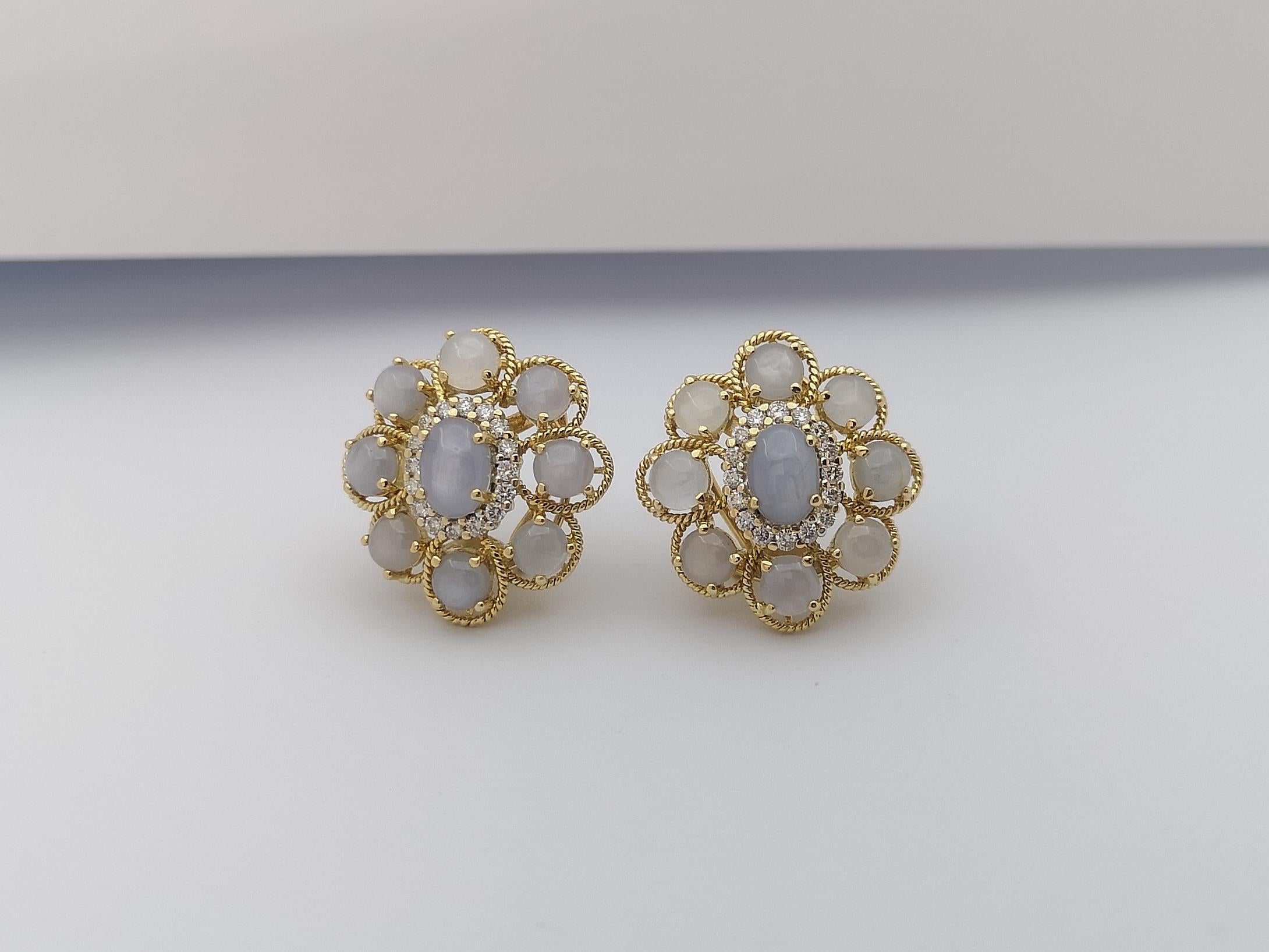 Cabochon Blue Star Sapphire with Brown Diamond Earrings Set in 18 Karat Gold Settings For Sale