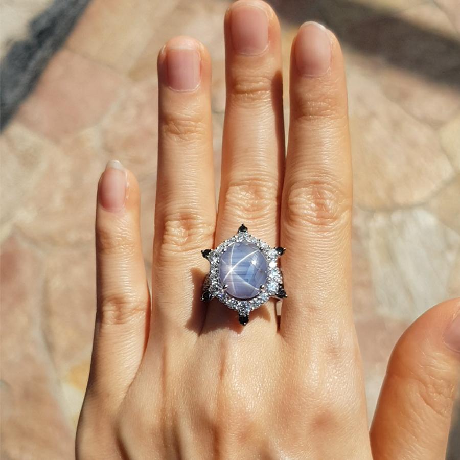 Blue Star Sapphire 13.68 carats with Diamond 1.86 carats and Black Diamond 0.40 carat Ring set in 18 Karat White Gold Settings

Width: 2. cm
Length: 2.1 cm 
Ring Size: 55

