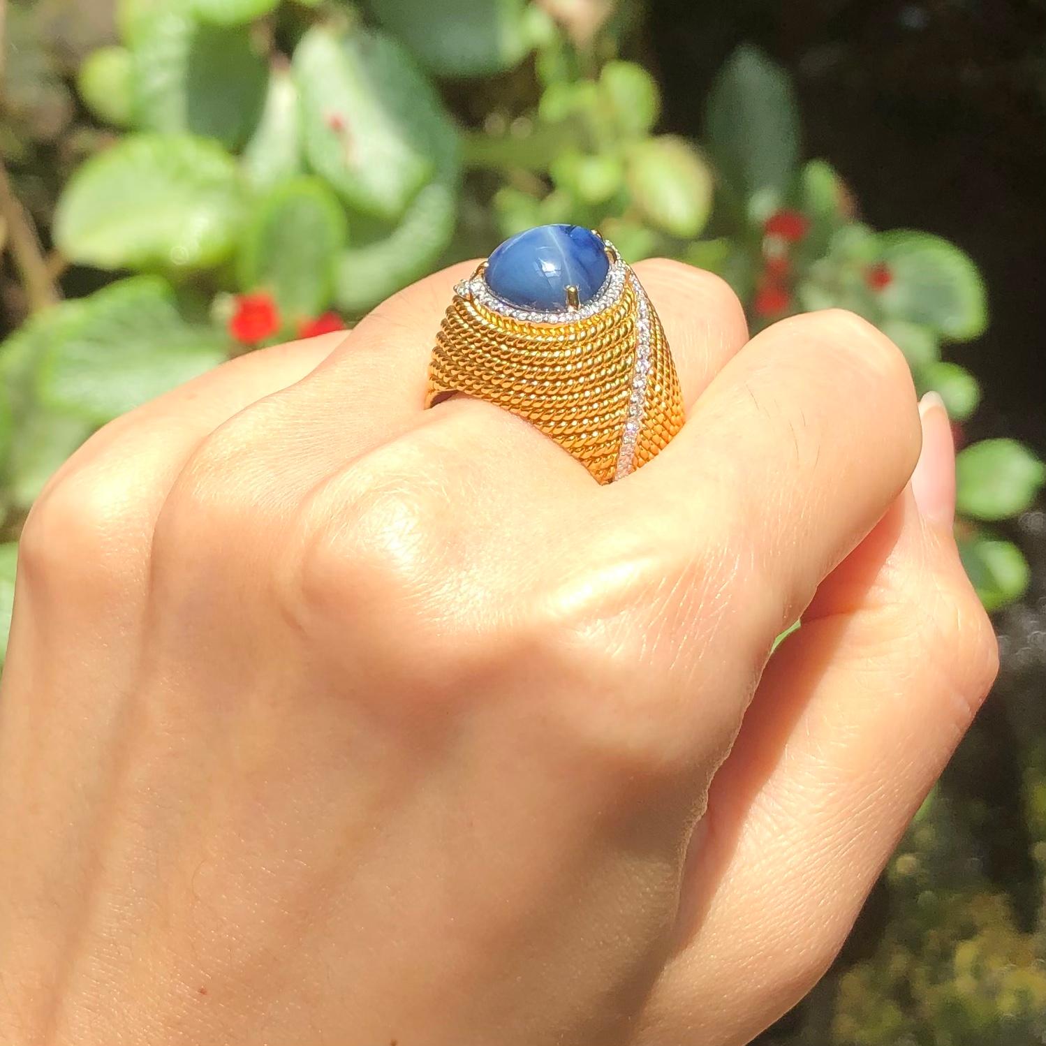 Contemporary Blue Star Sapphire with Diamond Ring Set in 18 Karat Gold Settings For Sale